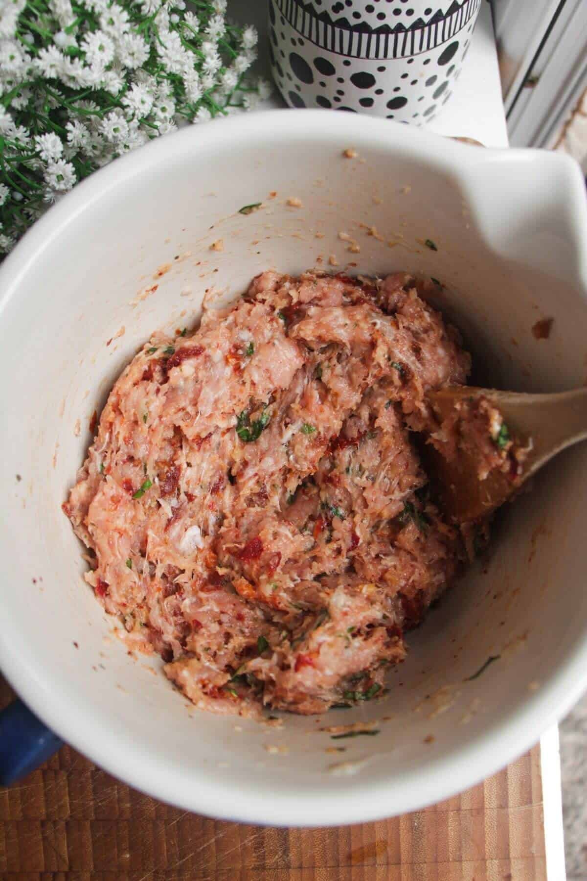 Ingredients for 'Marry Me' chicken meatballs mixed in a bowl.