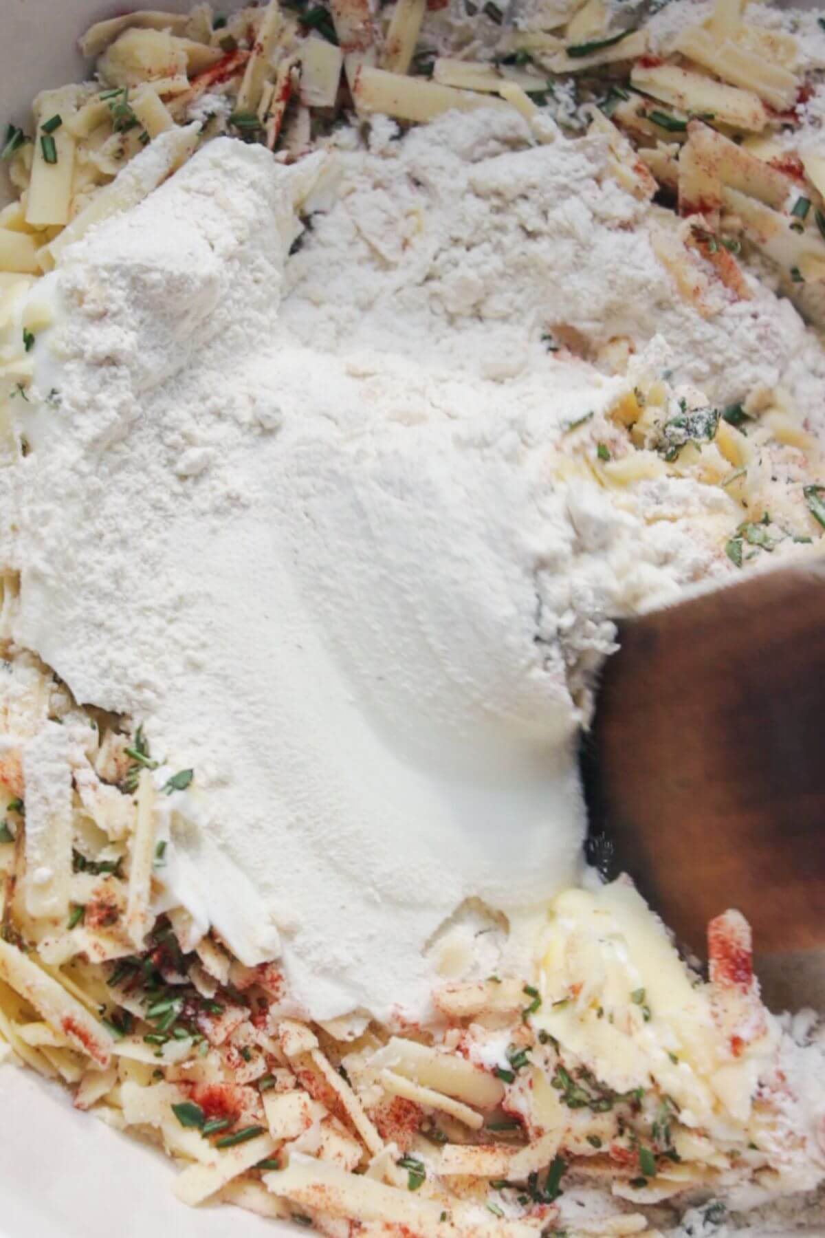 Wooden spatula mixing scone dough.