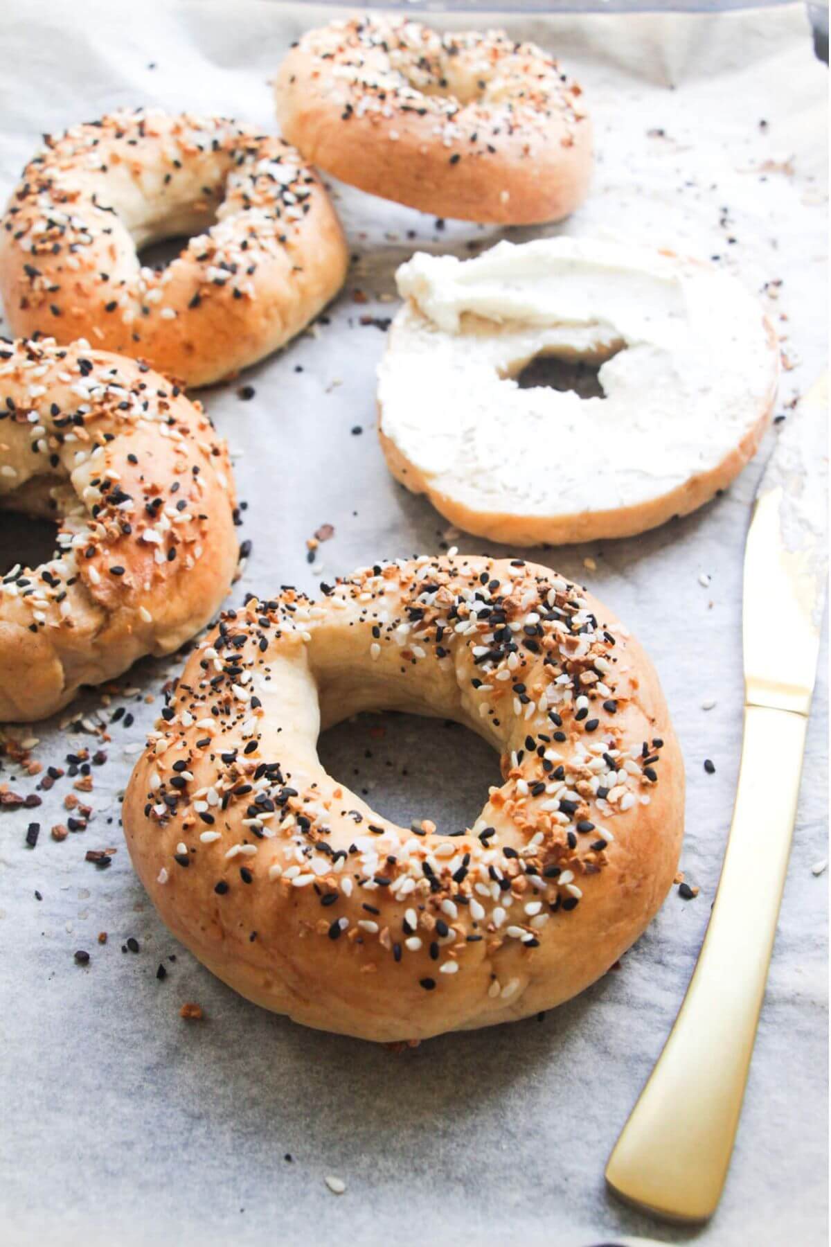 2 ingredient Greek yogurt bagels on a lined oven tray.
