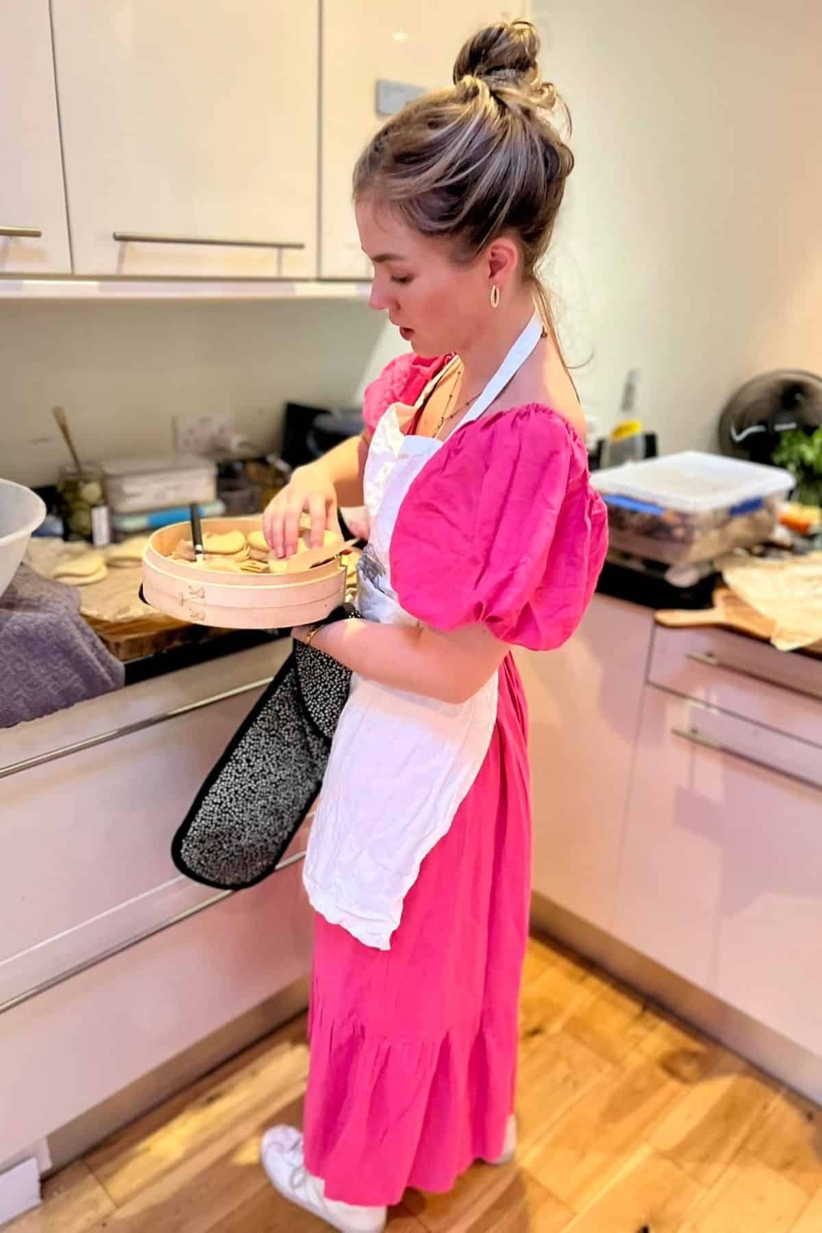 Kate cooking in kitchen.
