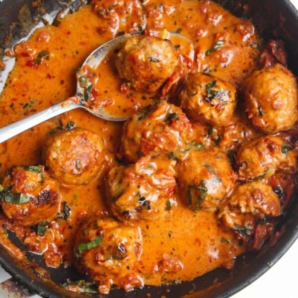 'Marry Me' chicken meatballs in sundried tomato sauce in a small pan.