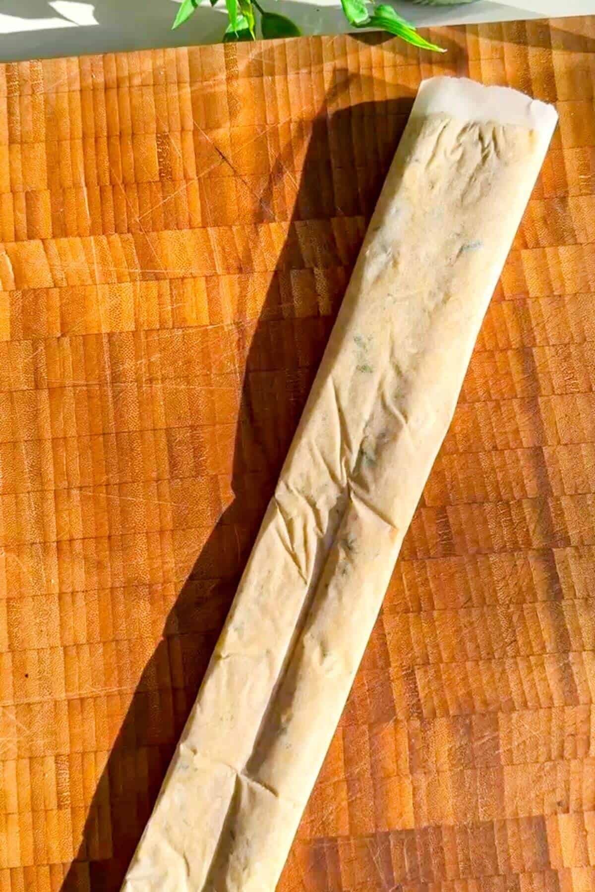 Doner mixture rolled up in parchment paper.