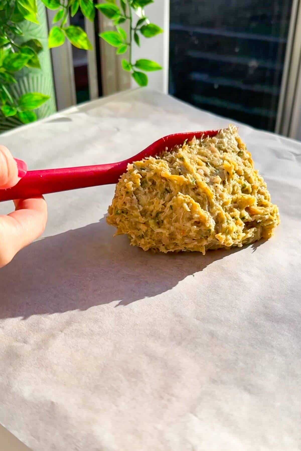 Ground chicken doner mix on a piece of parchment paper.