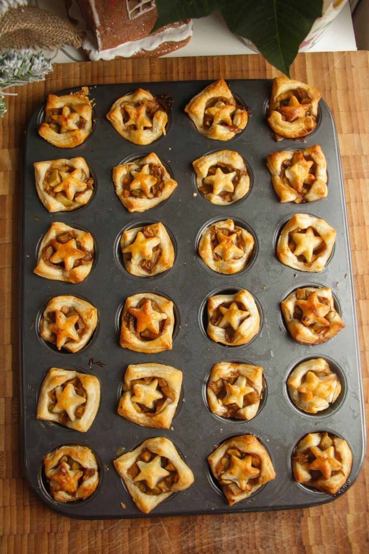 Apple pie bites cooked in a mini muffin pan.