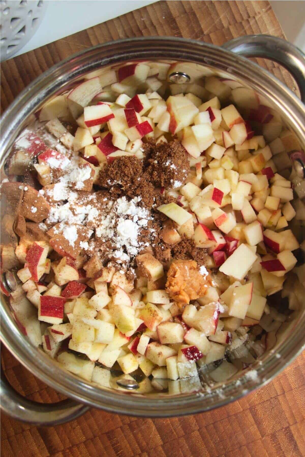 Diced apples, brown sugar, cornstarch, miso paste in a small pot.