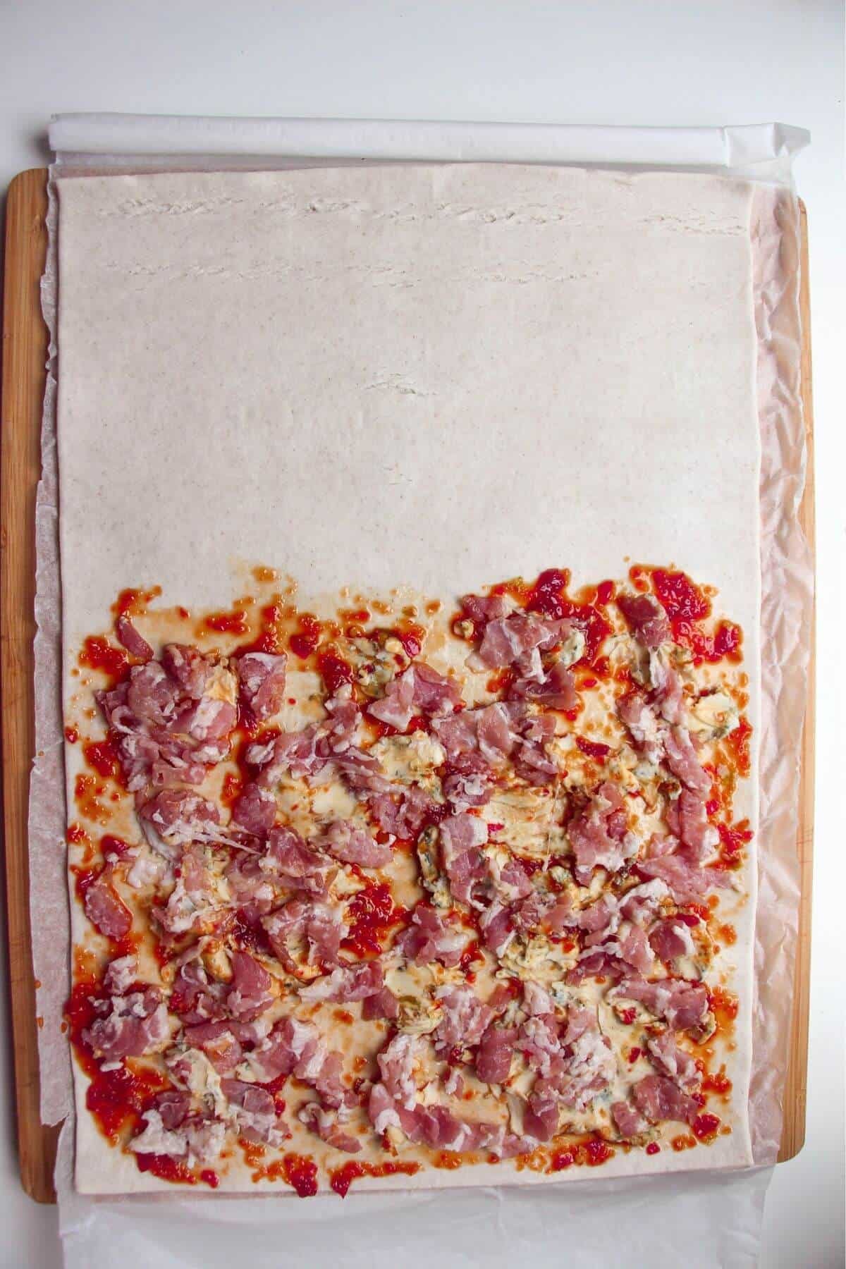 Sweet chilli, bacon and blue cheese on puff pastry.