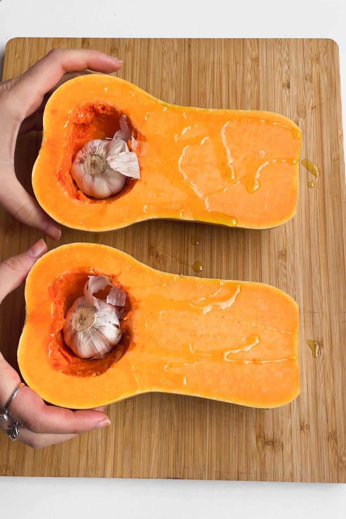 Squash sliced lengthways with whole garlic heads in the middle.