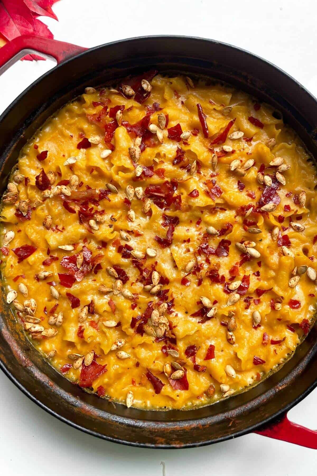 Butternut squash mac and cheese topped with crispy squash seeds and prosciutto.