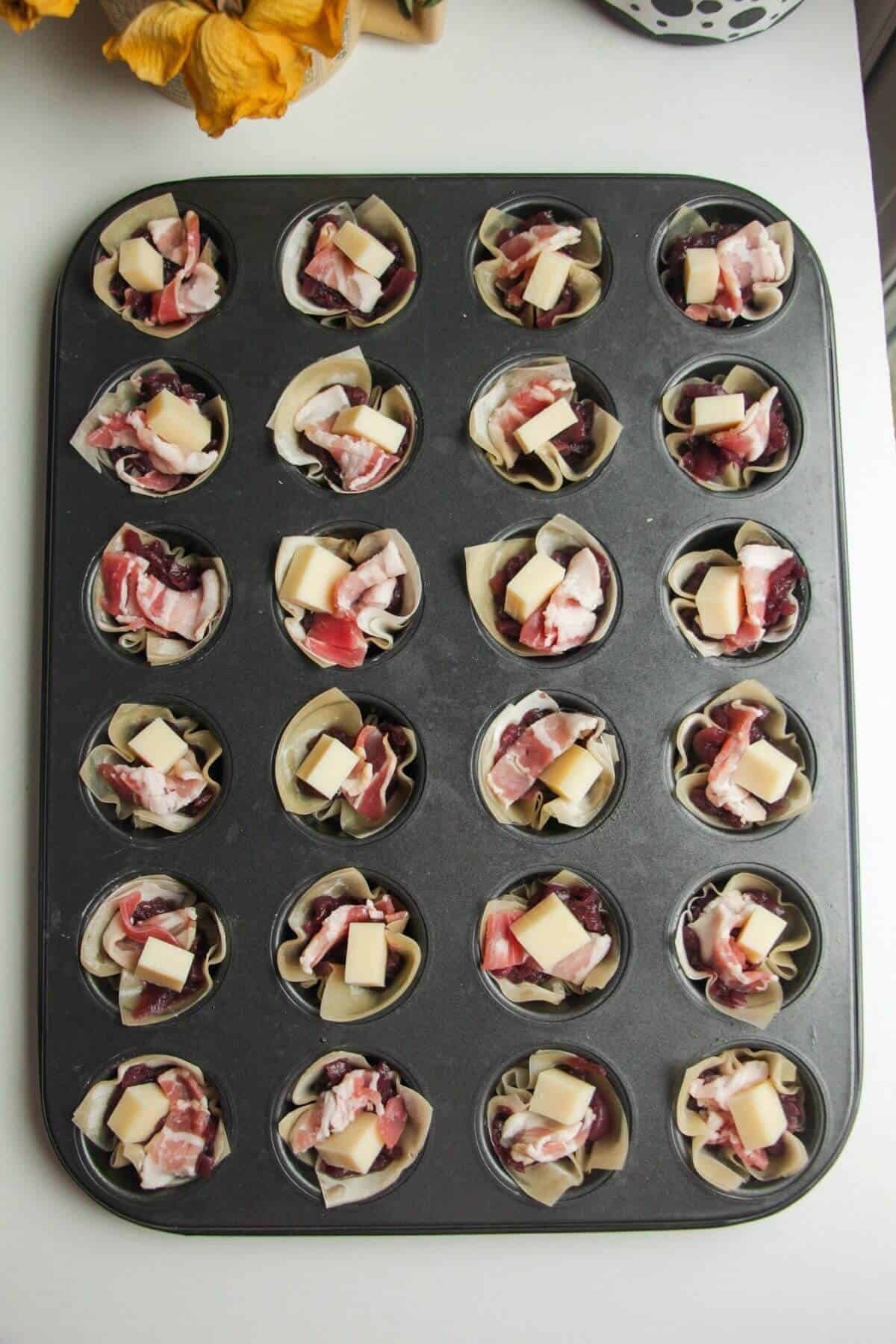 Caramelized onion, Gruyere and bacon in filo in a mini muffin pan.