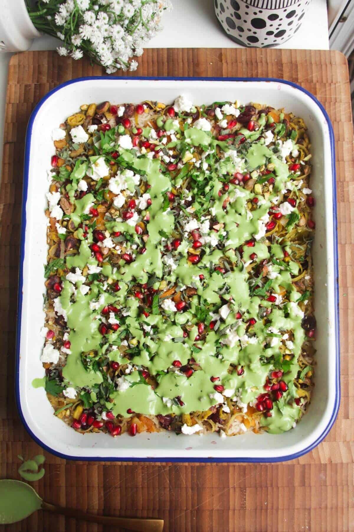 Green tahini sauce on rice.
