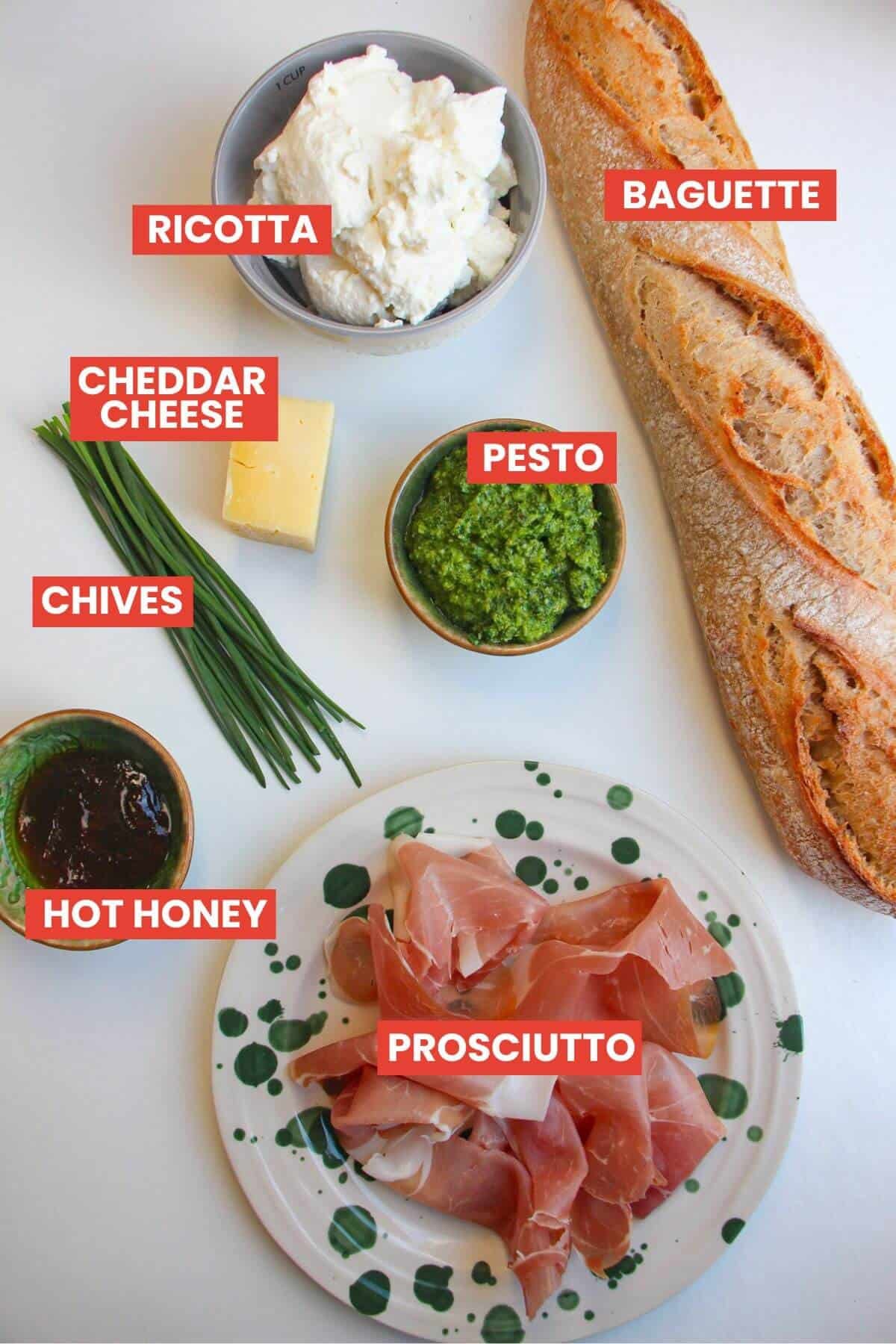 Ingredients for herby ricotta crostini laid out and labelled.