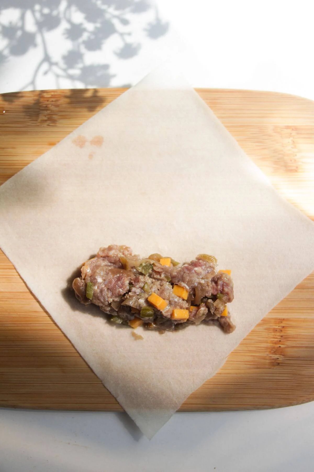 Cheeseburger filling on spring roll wrapper.