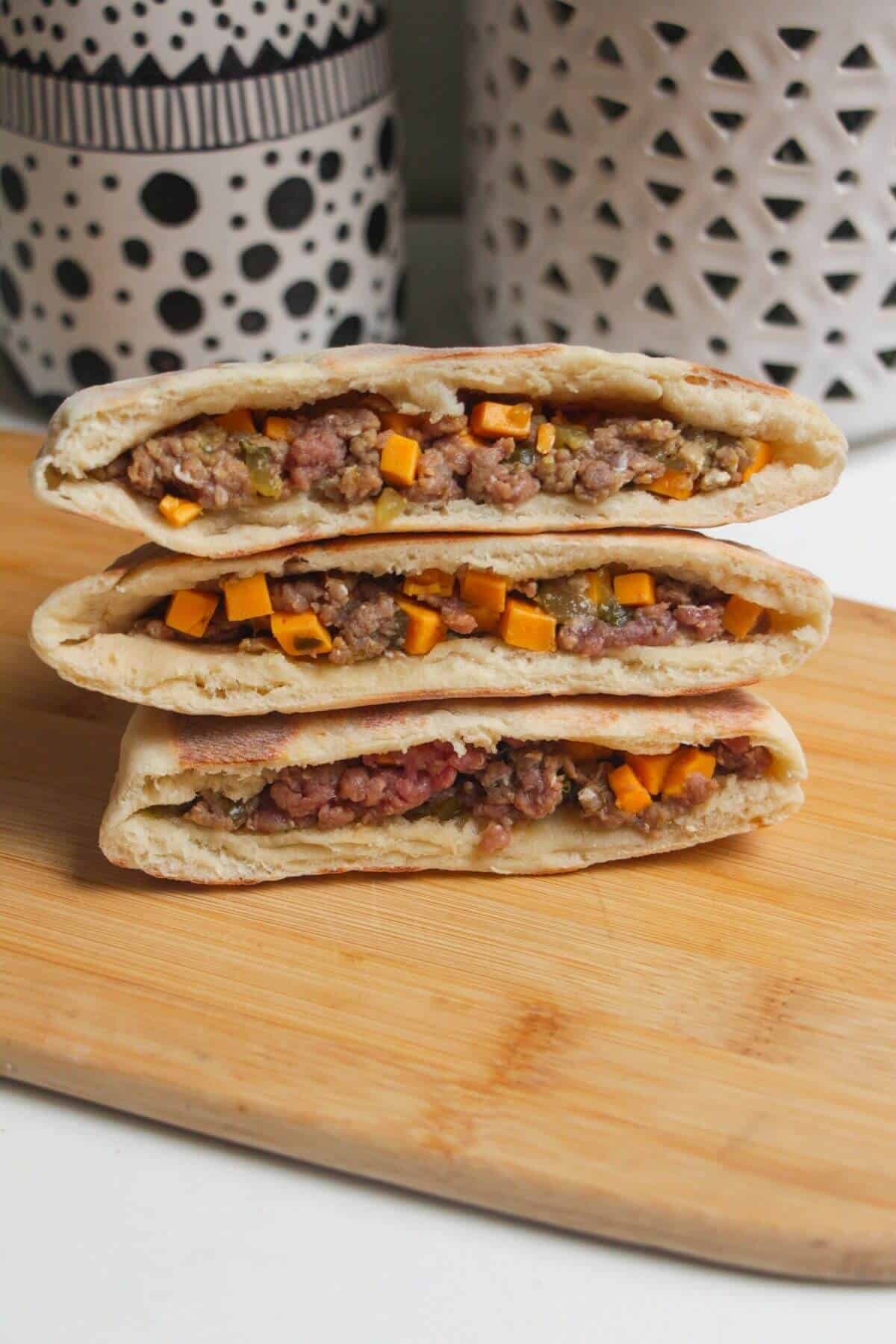 Flatbreads stuffed with cheeseburger mixture.