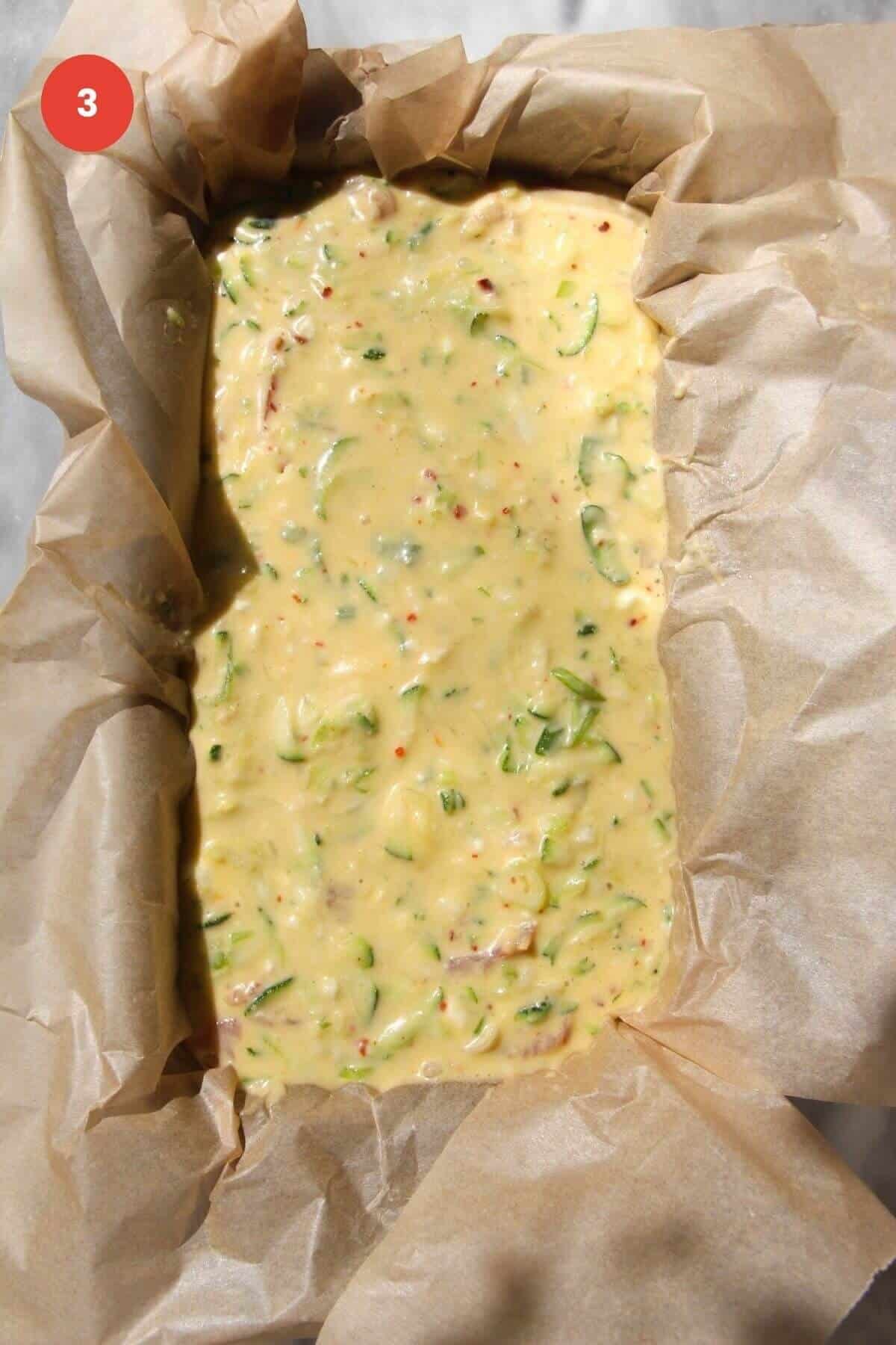 Zucchini bread mixture poured into loaf pan.