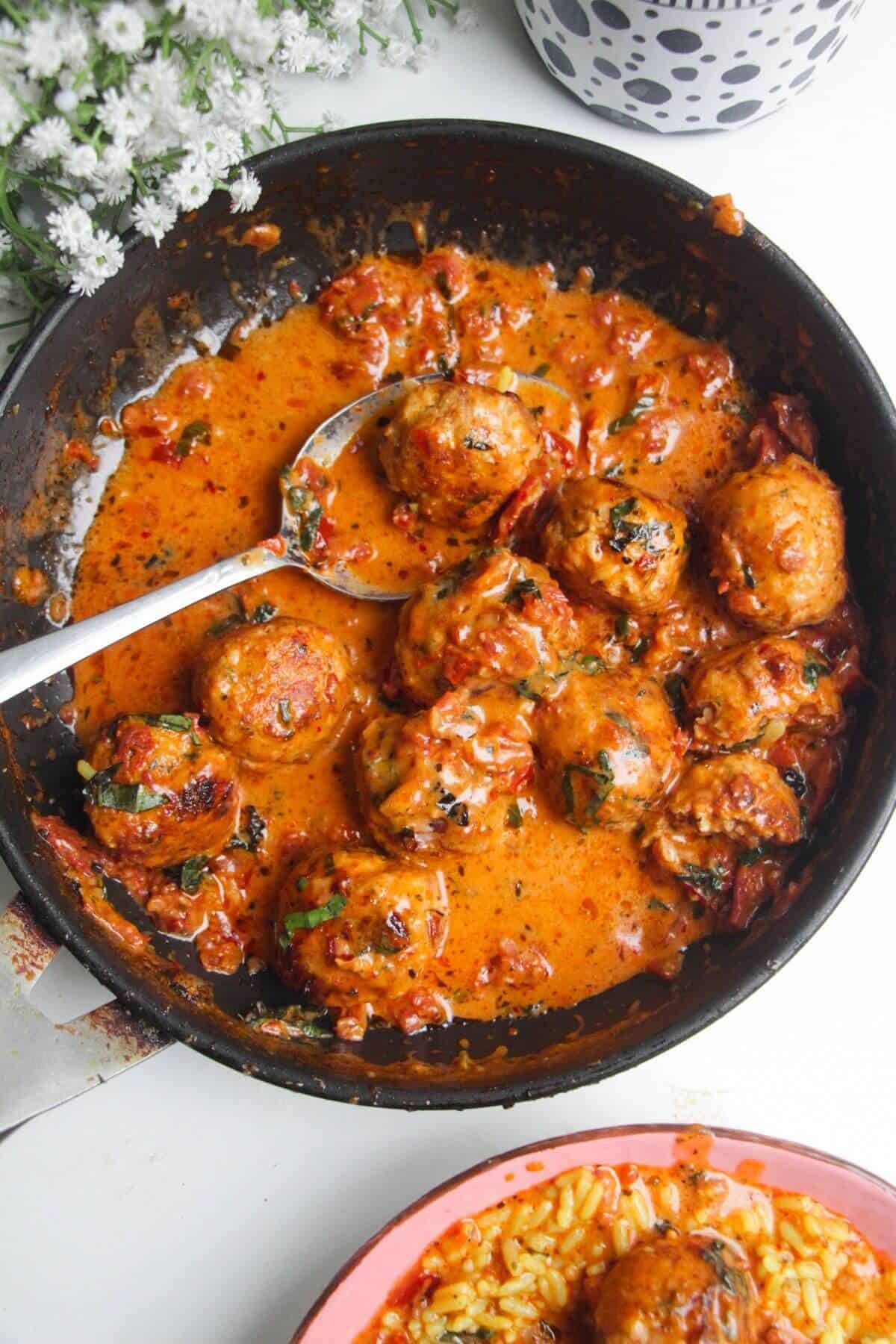 'Marry Me' chicken meatballs in sundried tomato sauce in a small pan.