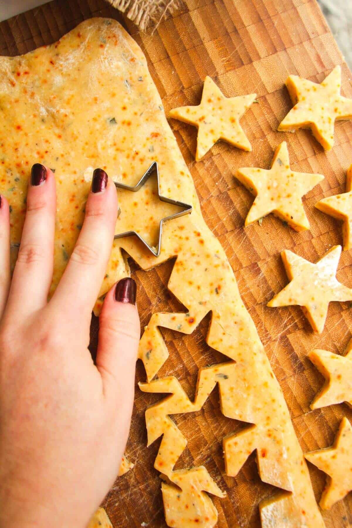 Cutting stars from shortbread dough.