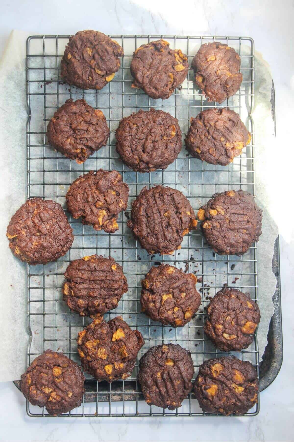 Baked chocolate Afghans on a wire rack.
