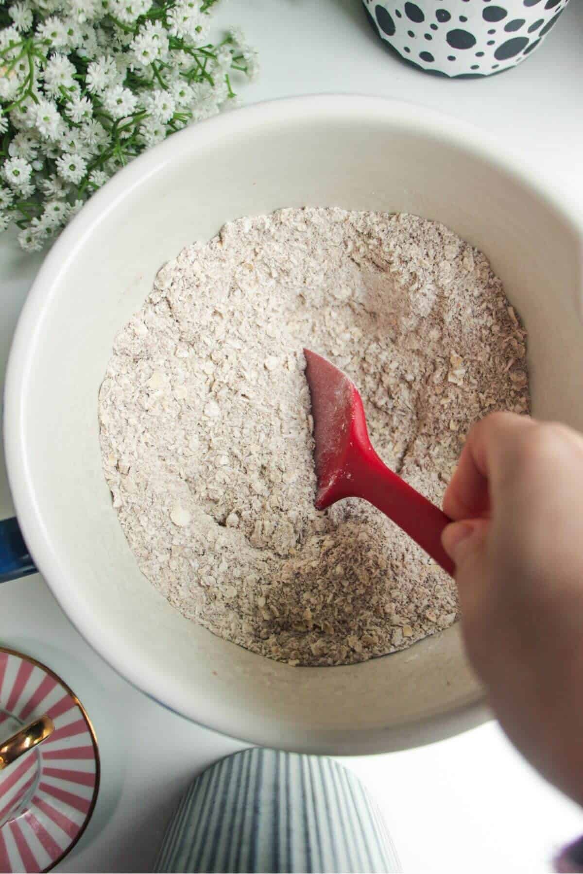 Mixing dry ingredients in a mixing bowl.