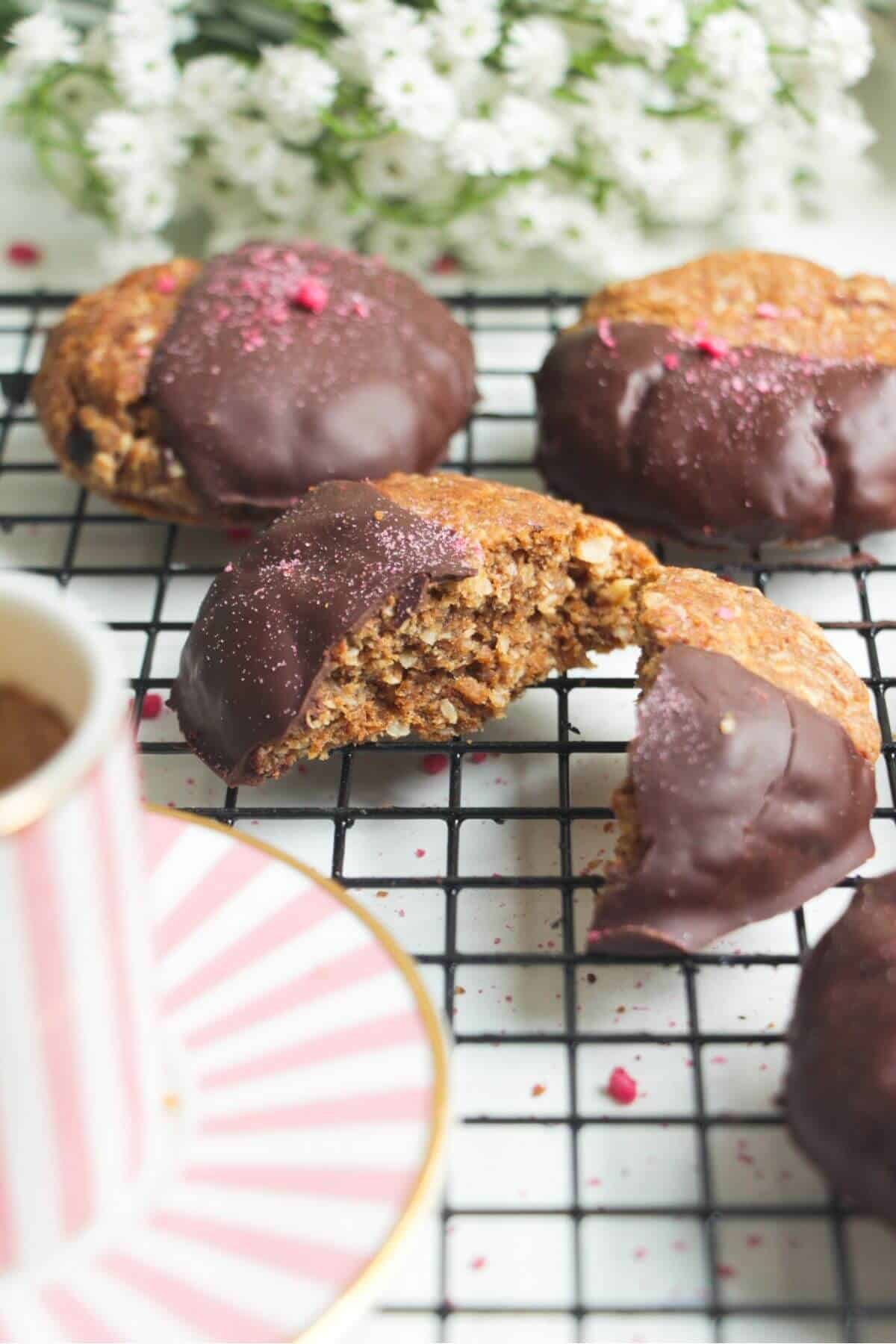 Broken open chocolate dunked Anzac biscuit.