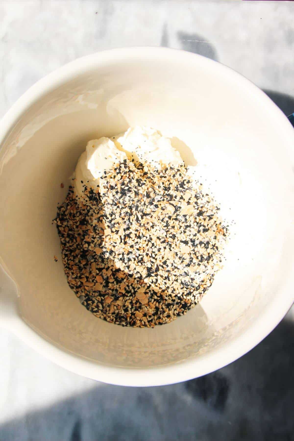 Greek yogurt, cream cheese, everything bagel seasoning and lemon juice in a mixing bowl.