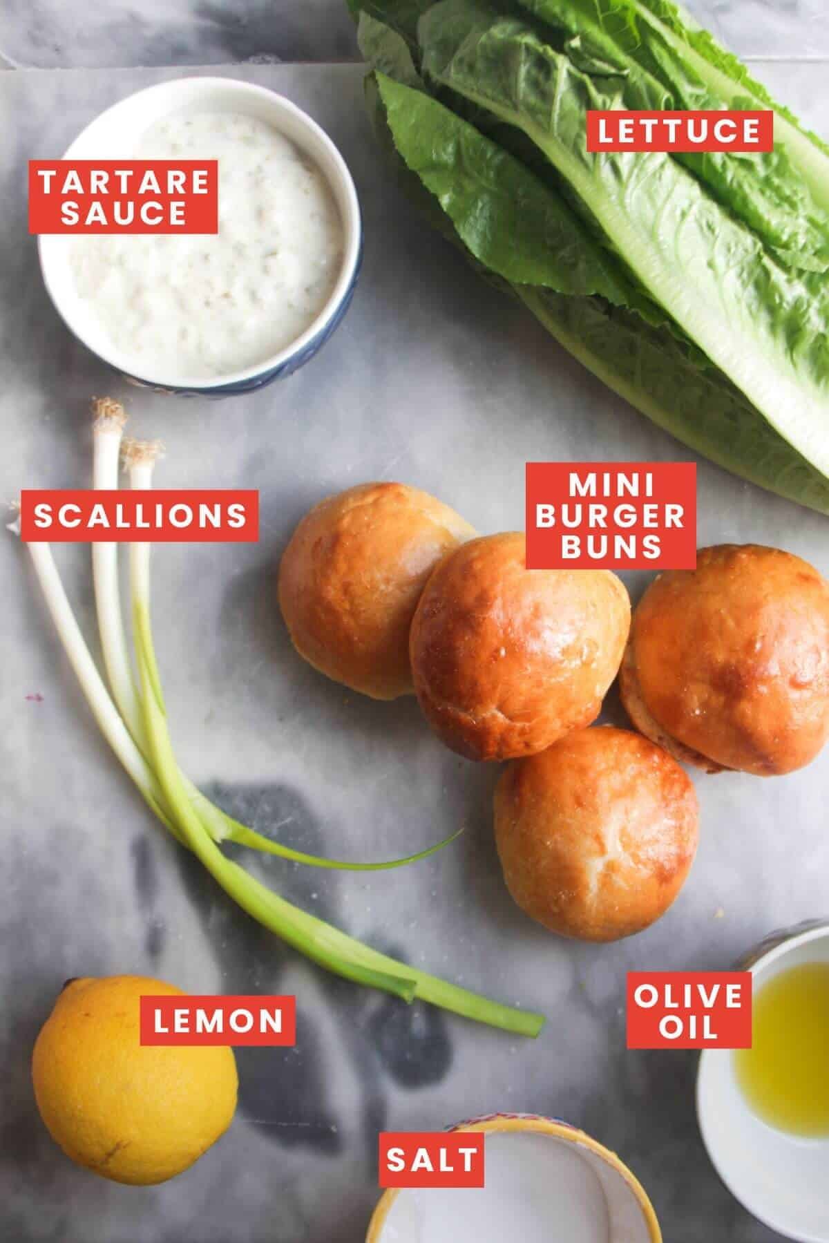 Ingredients for mini sliders laid out on a grey marble background and labelled.