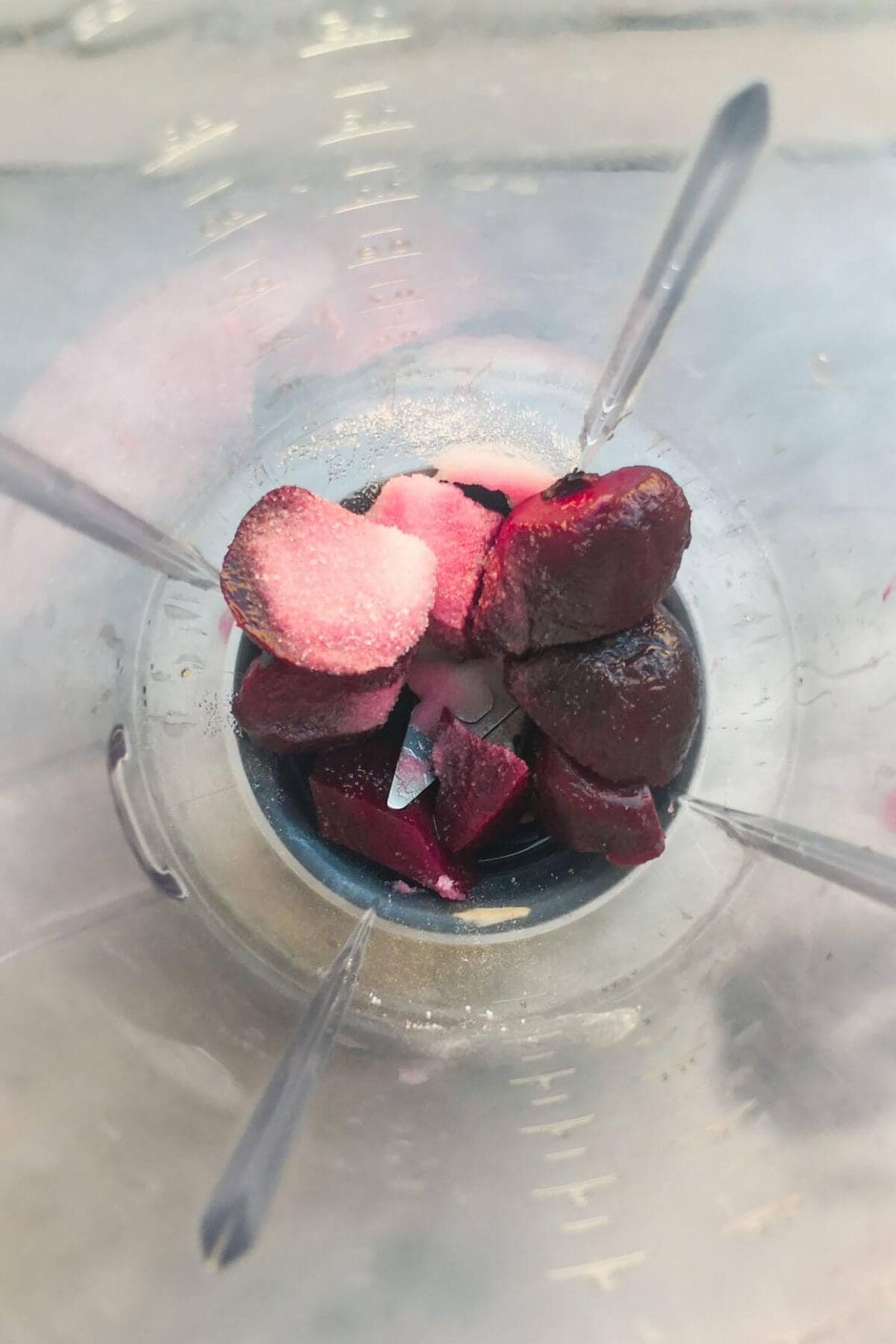 Beetroot, salt, lemon juice and water in the bowl of a blender.