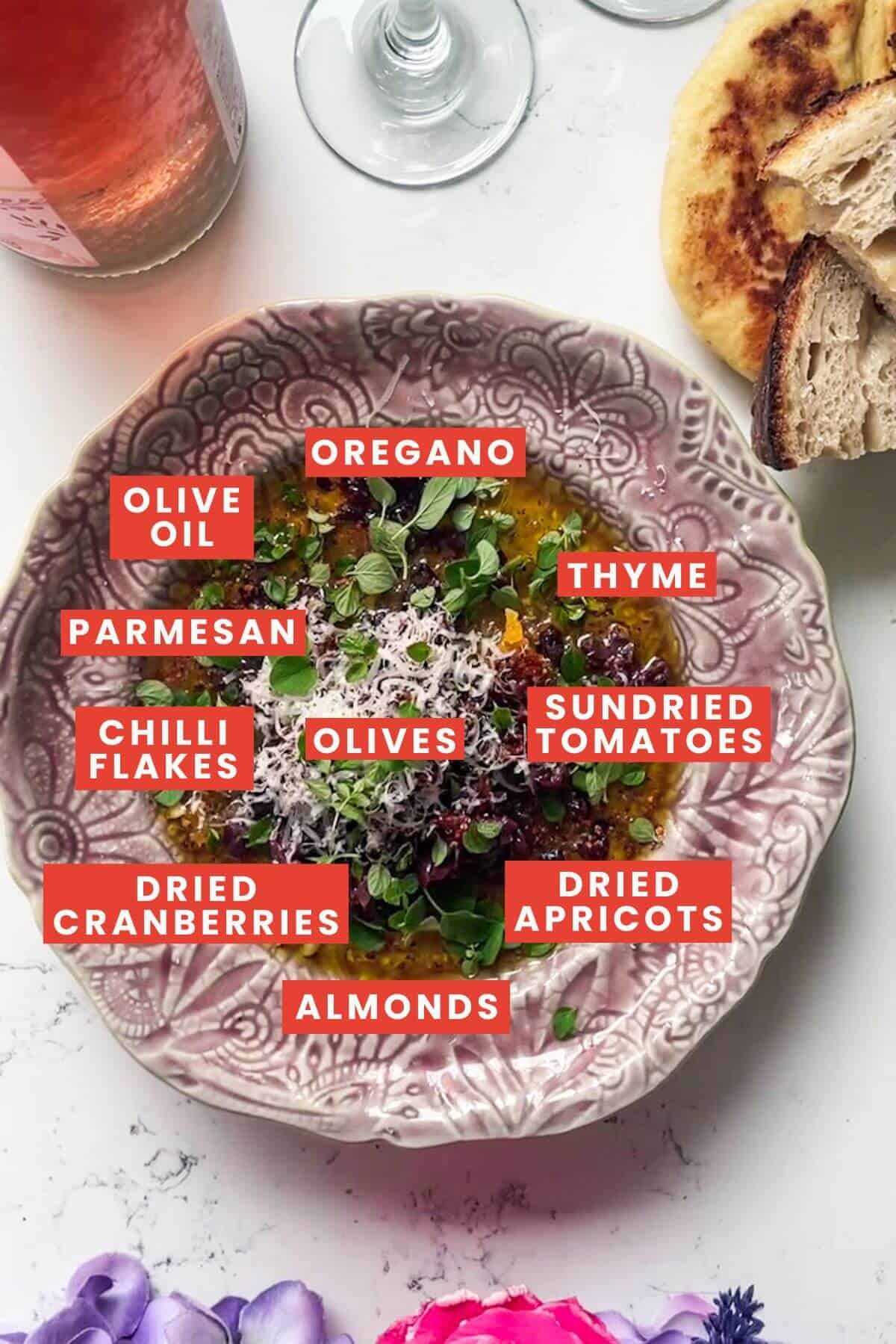 Ingredients for date night bread dipping oil in a small pink plate and labelled.