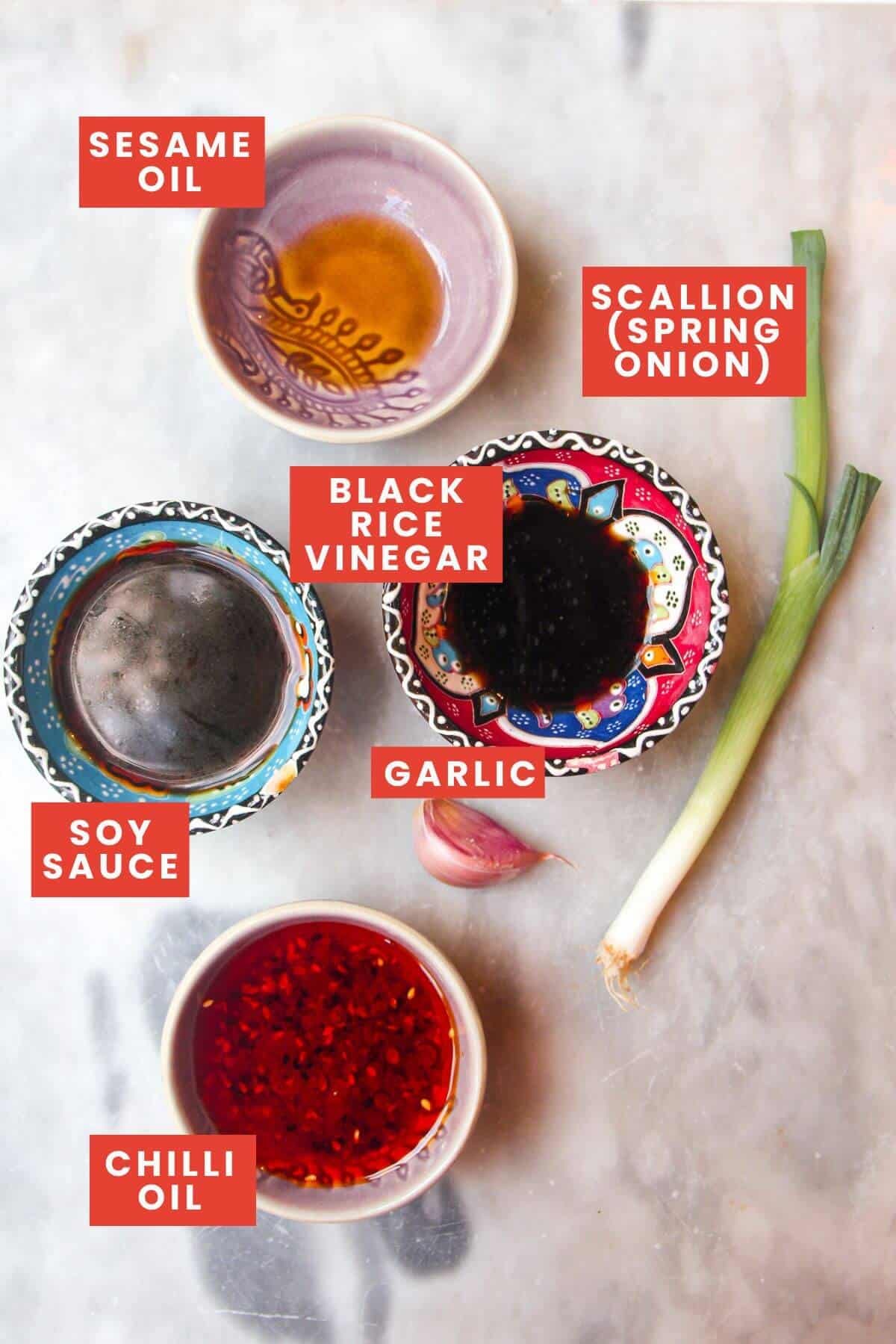 Ingredients for dumpling sauce laid out and labelled.