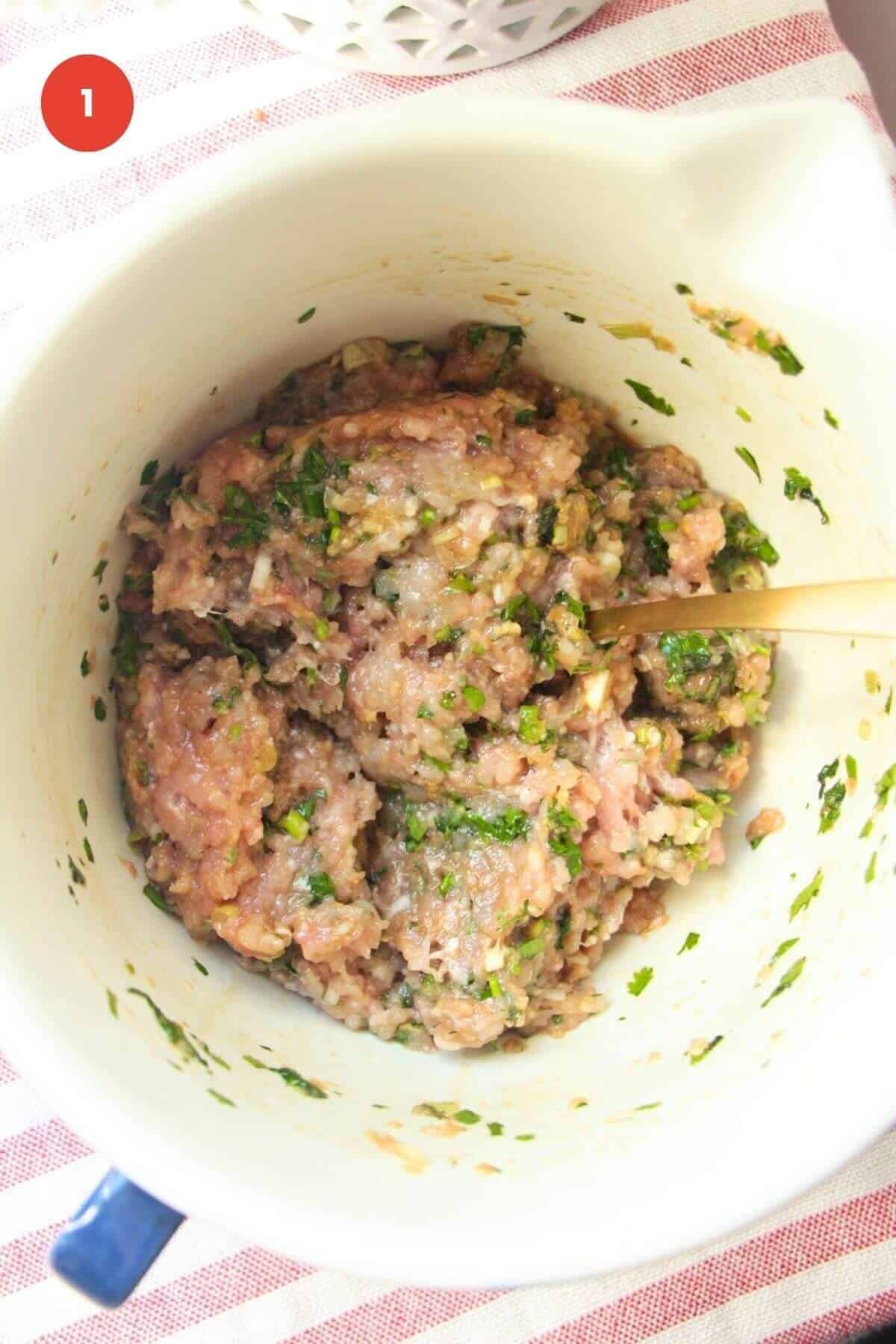 Dumpling mixture in a large bowl.