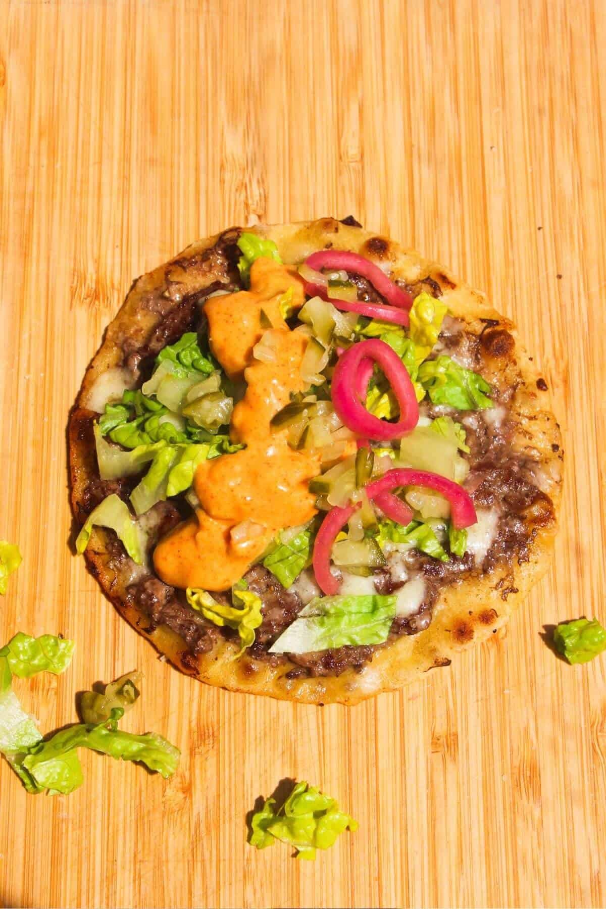 Lettuce, pickles and Big Mac sauce piled onto beef in a tortilla.
