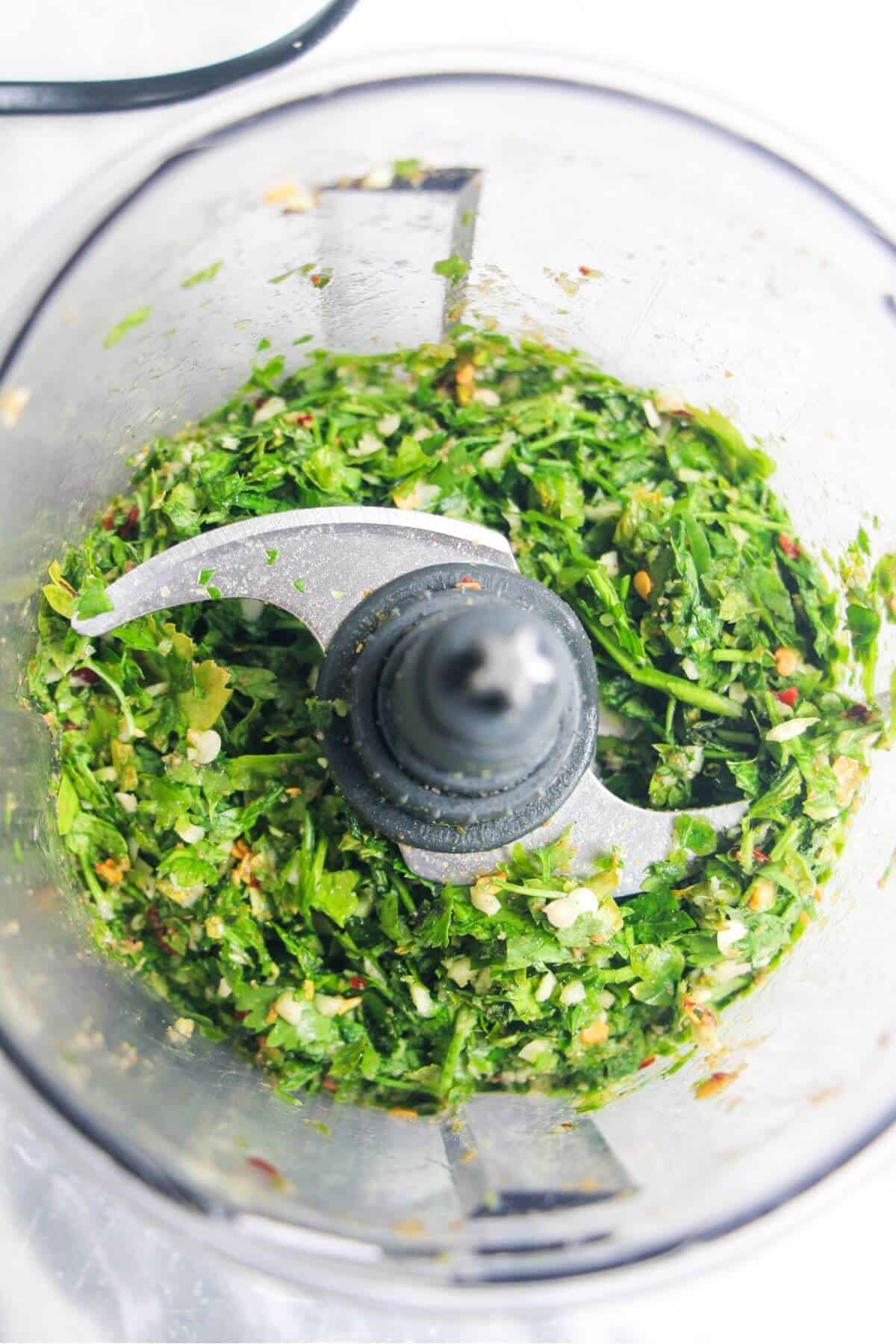Cilantro, spices and garlic blitzed to a rough paste in a small food processor.