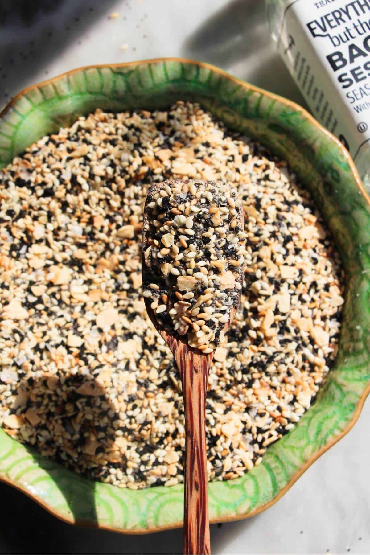 Everything bagel seasoning on a small wooden spoon.