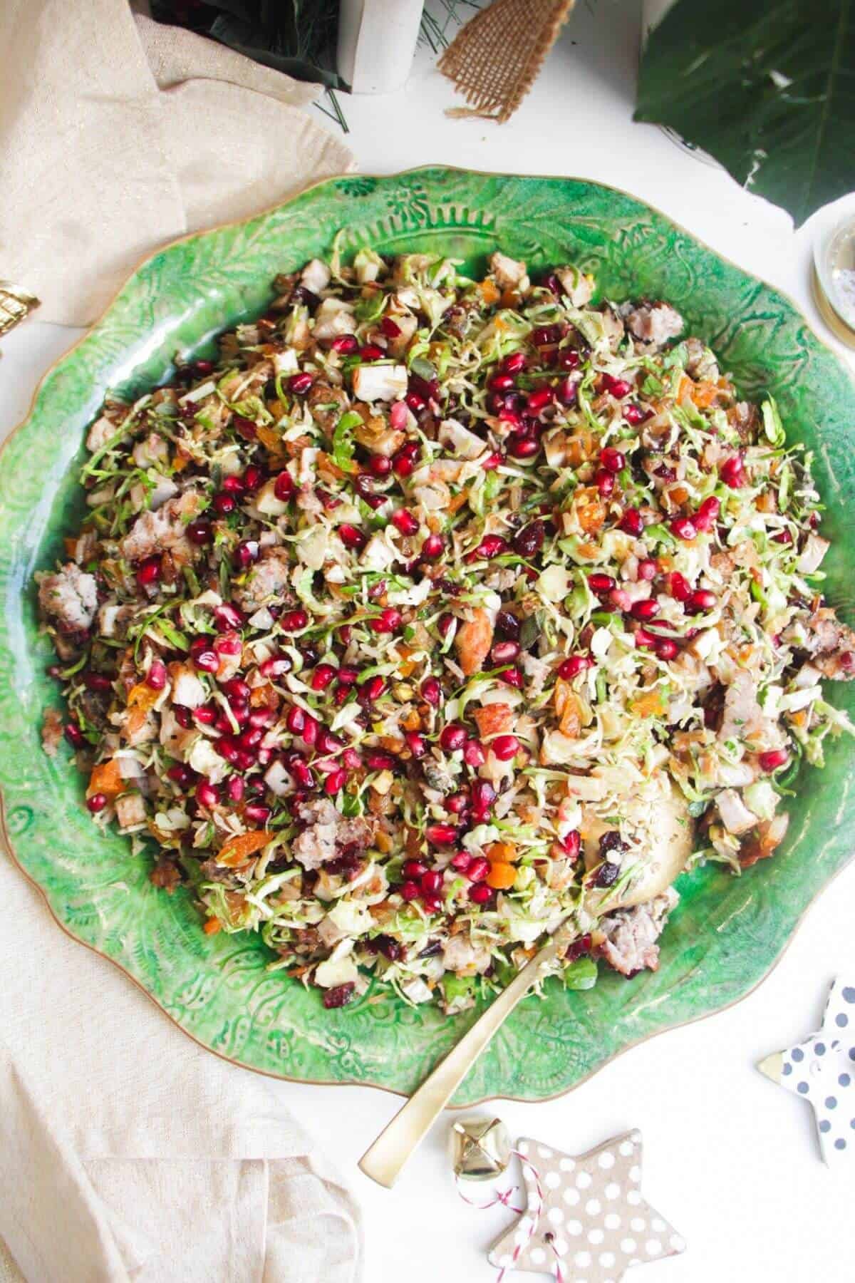 Festive crispy rice salad on a large green platter.