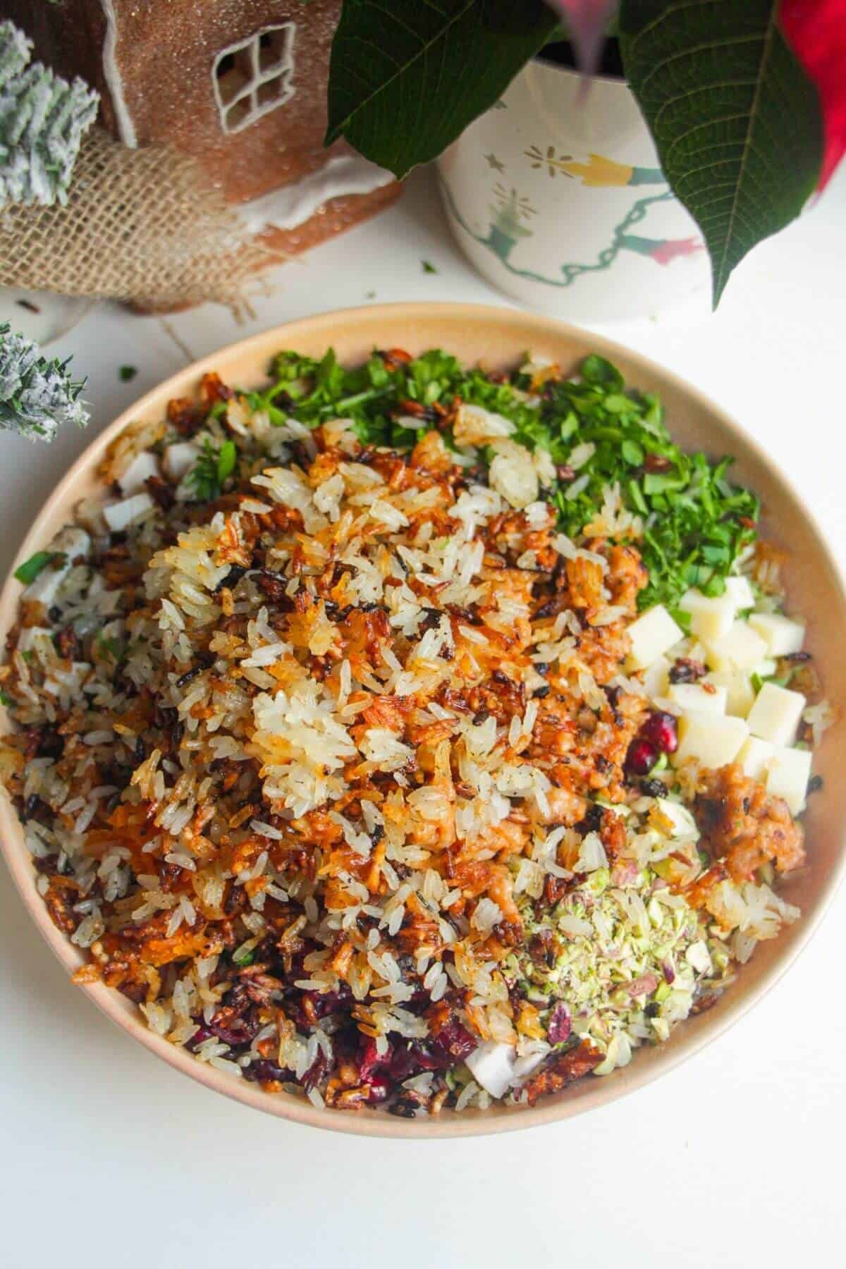 Crispy rice added to bowl with other salad ingredients.
