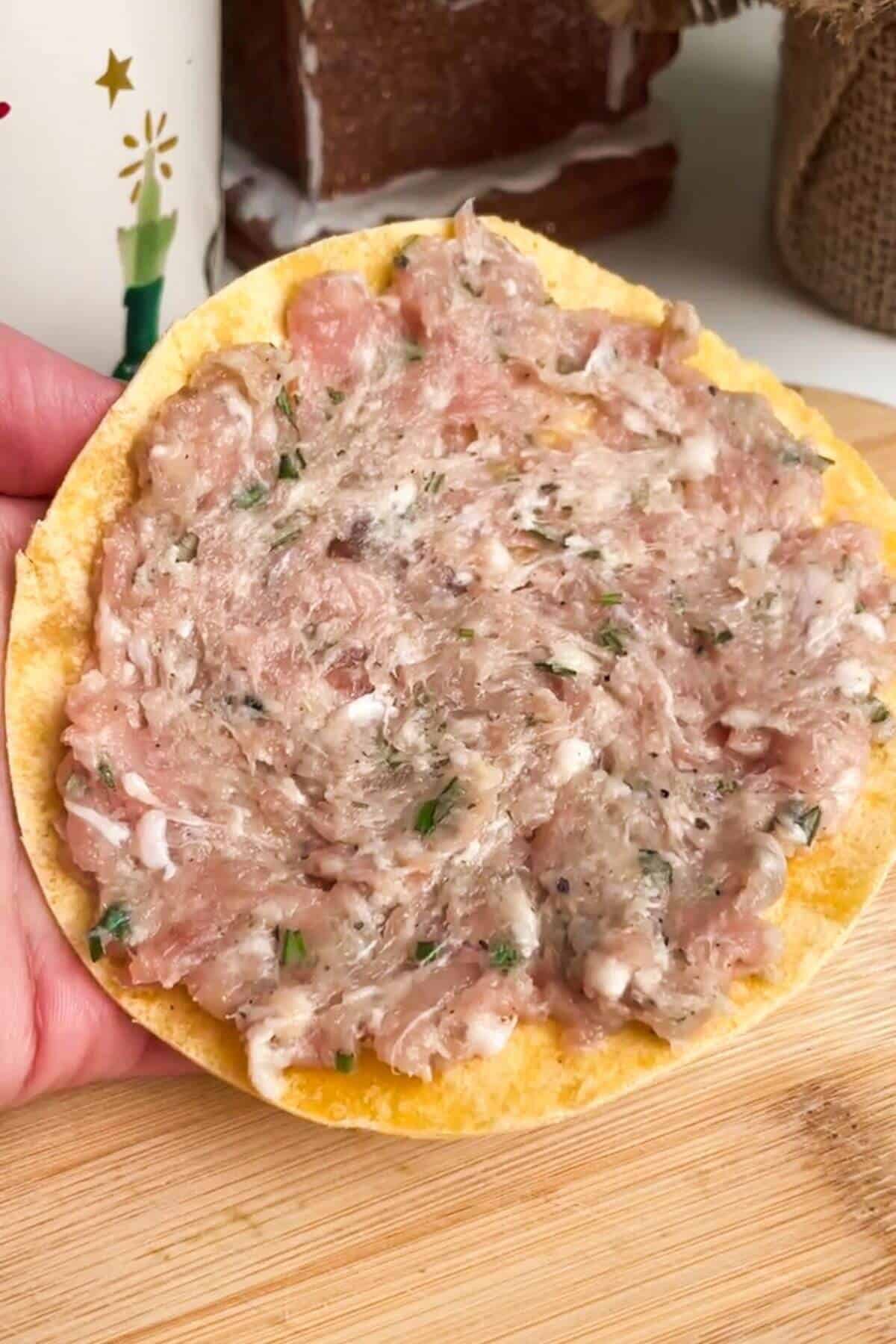 Taco topped with ground turkey and sausage mix.