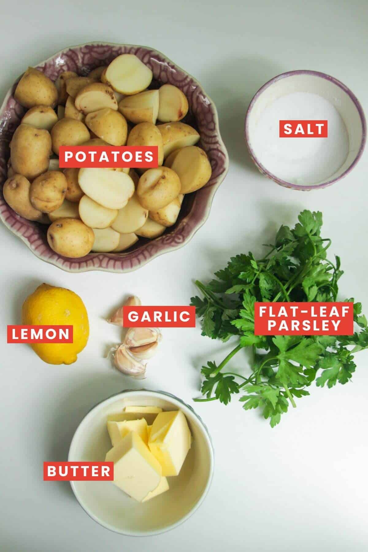 Ingredients for garlic butter potatoes laid out and labelled.