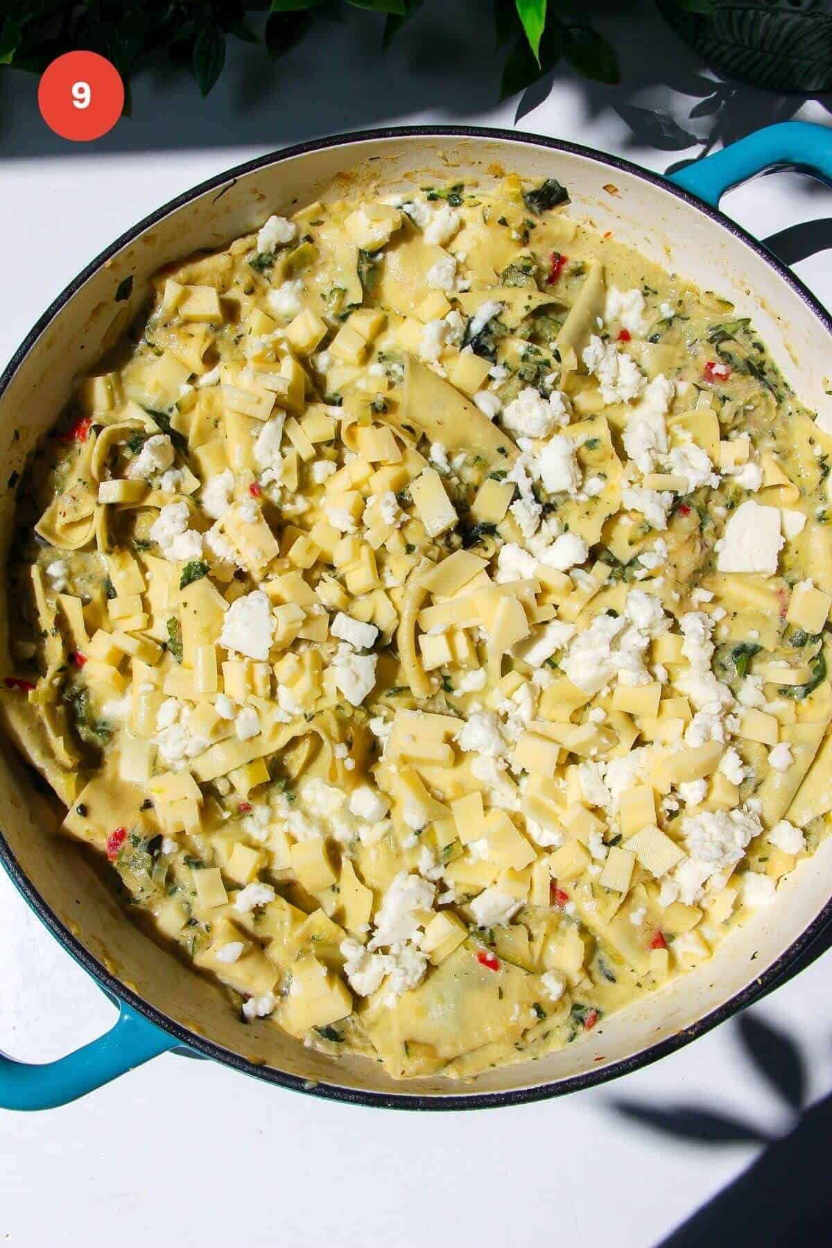 Mozzarella on top of green goddess lasagna in large skillet.