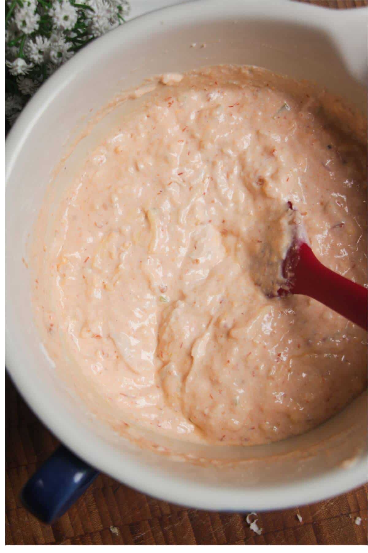 Buffalo chicken dip mixed in a bowl.