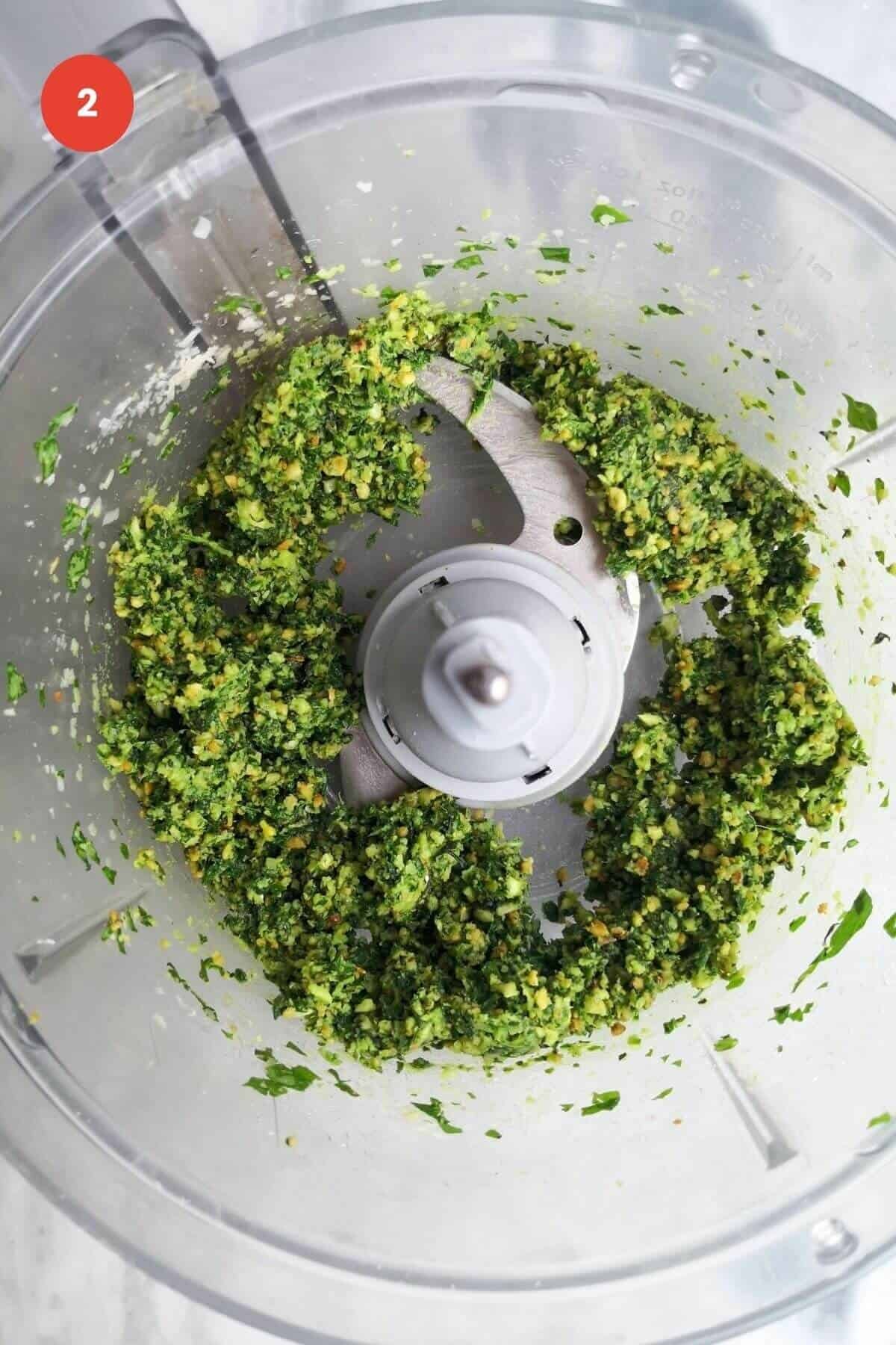 Basil pesto ingredients blended to a paste.