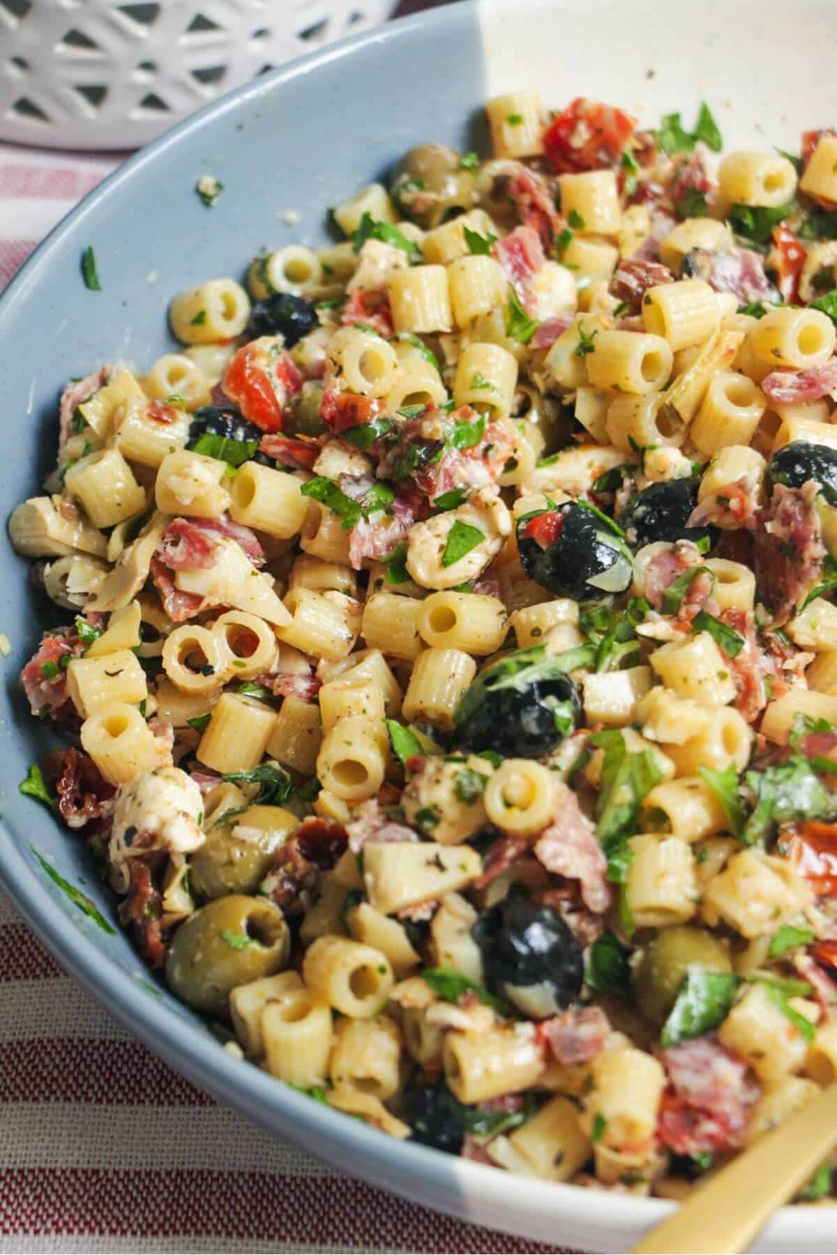 Italian deli antipasti pasta salad in a large serving bowl.