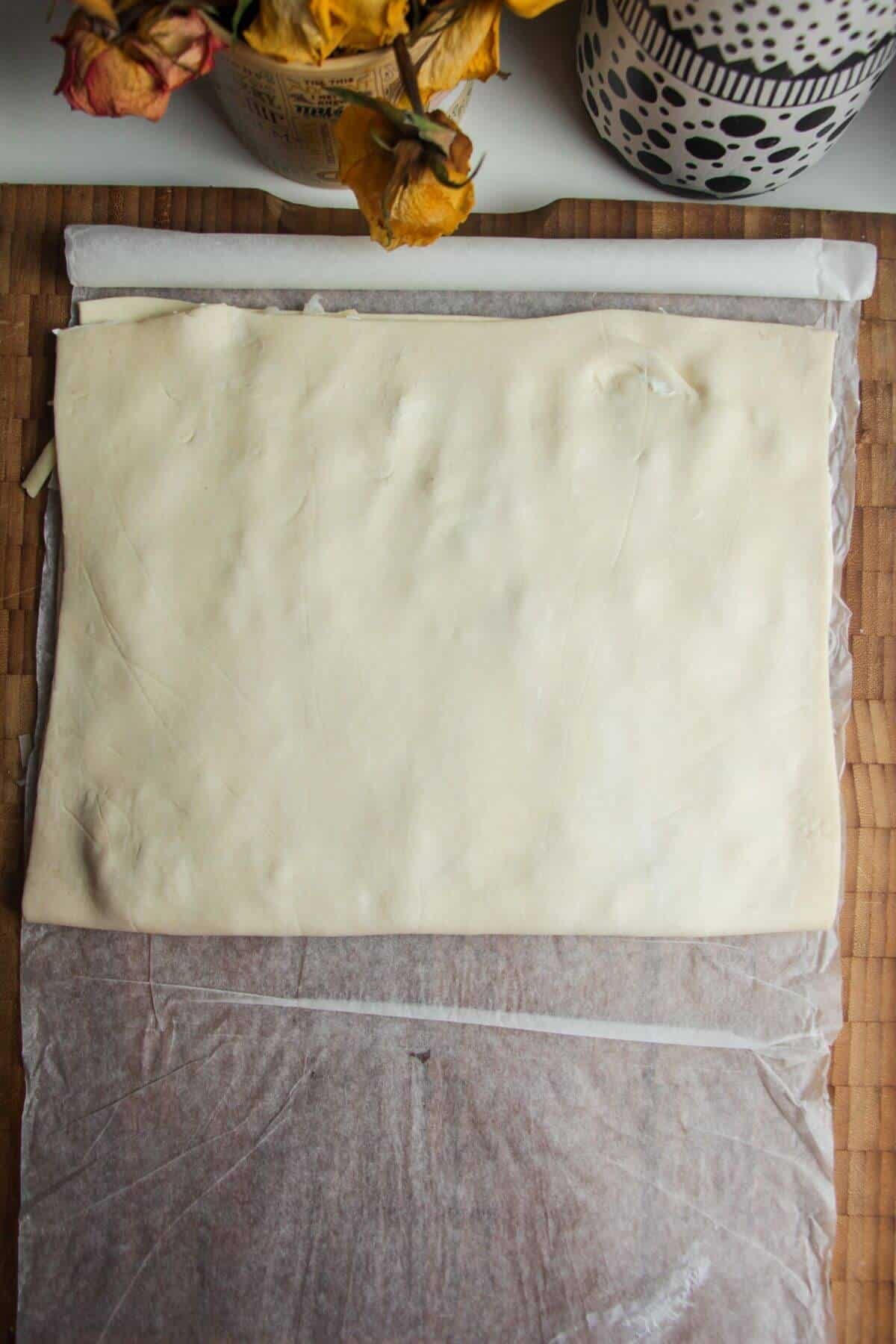 Puff pastry folded on top of jalapenos, bacon and cheese.