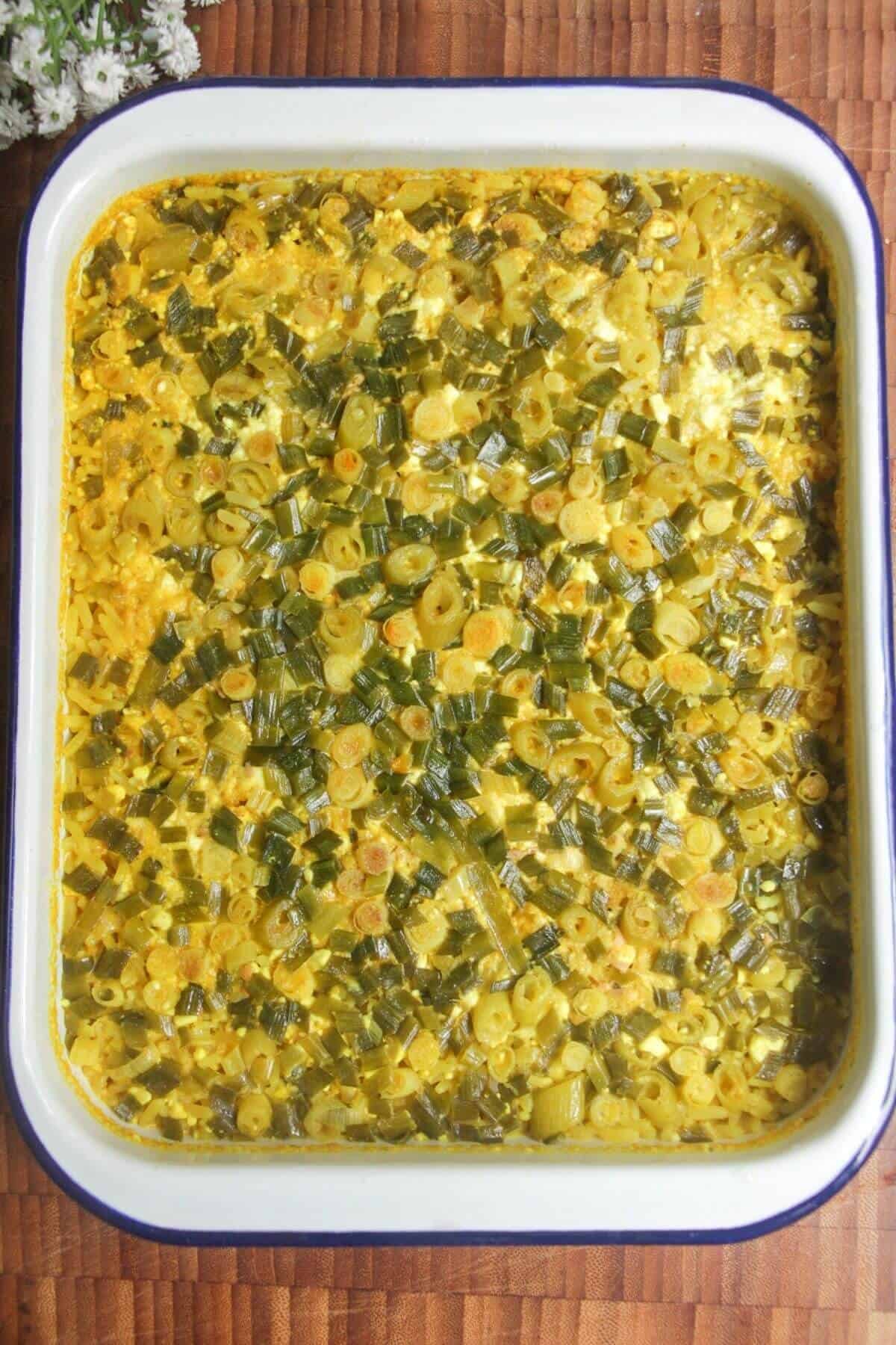 Baked loaded rice in a white tin.