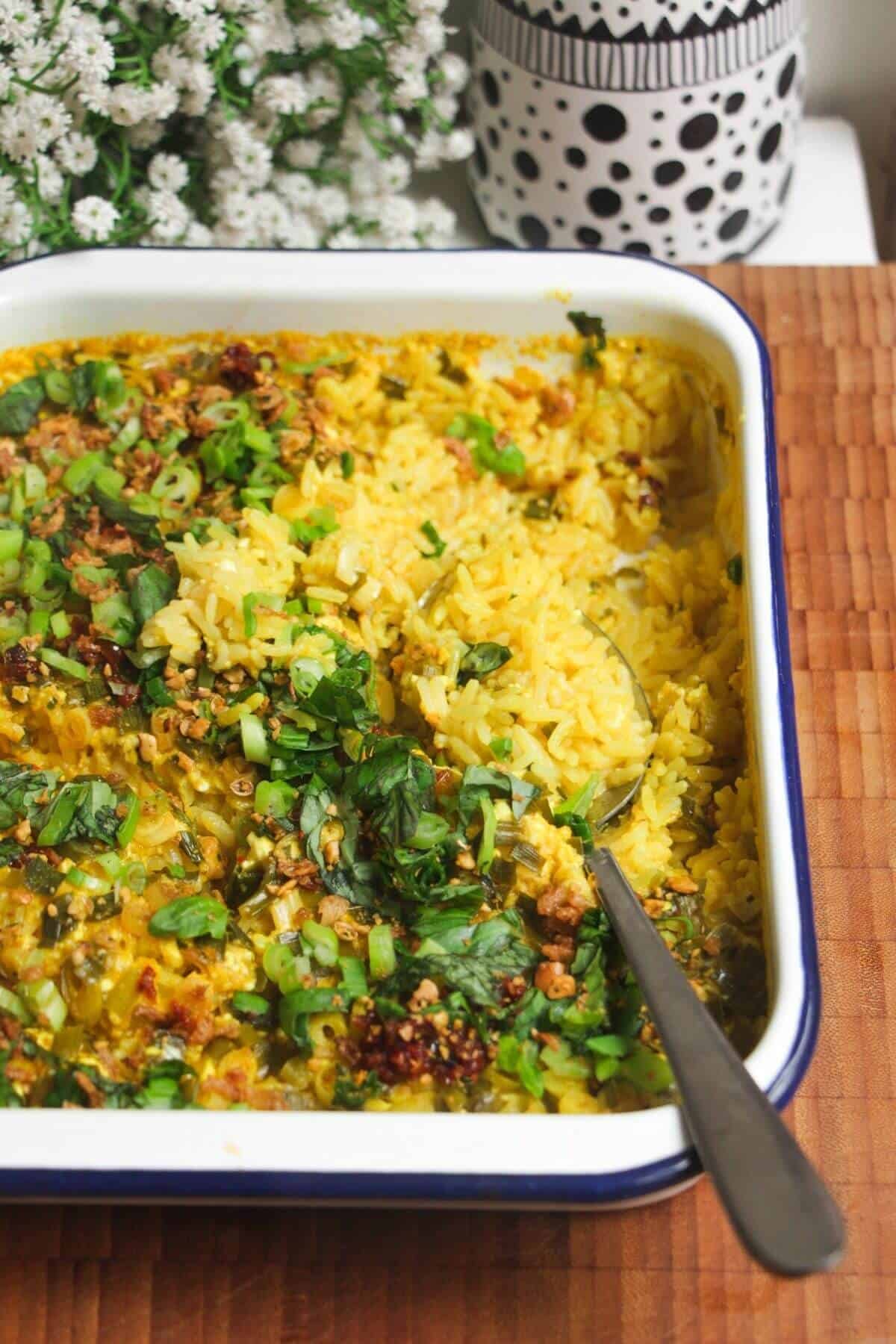 Baked rice topped with scallions and chilli oil.