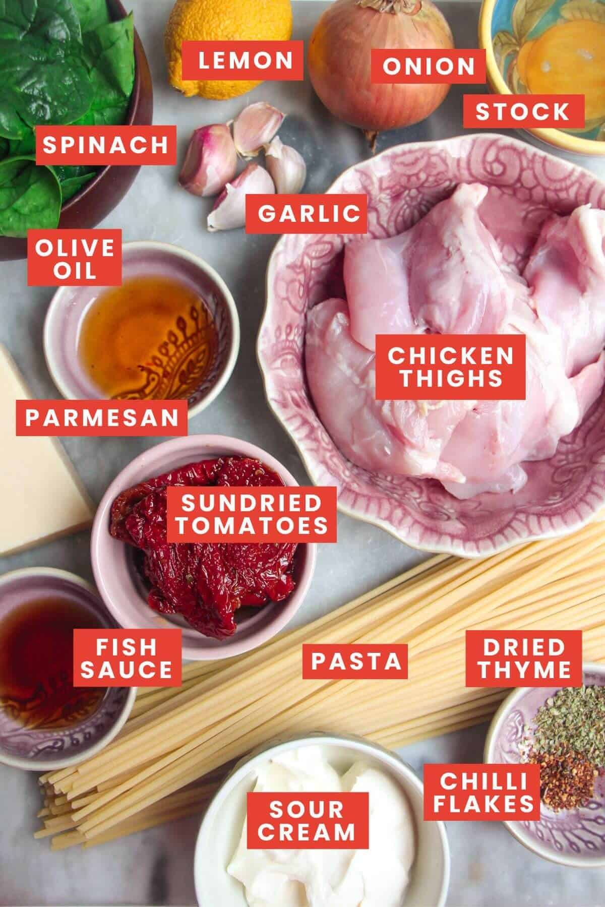 Ingredients for marry me chicken pasta laid out and labelled.