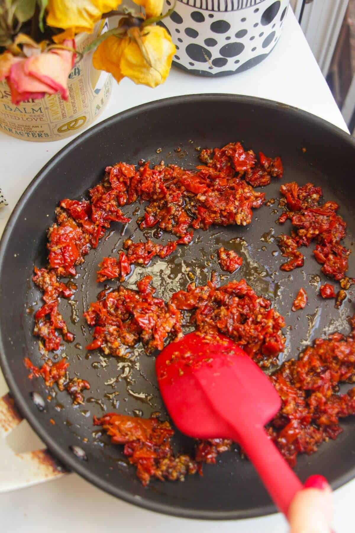 Sundried tomatoes in a small black pan.