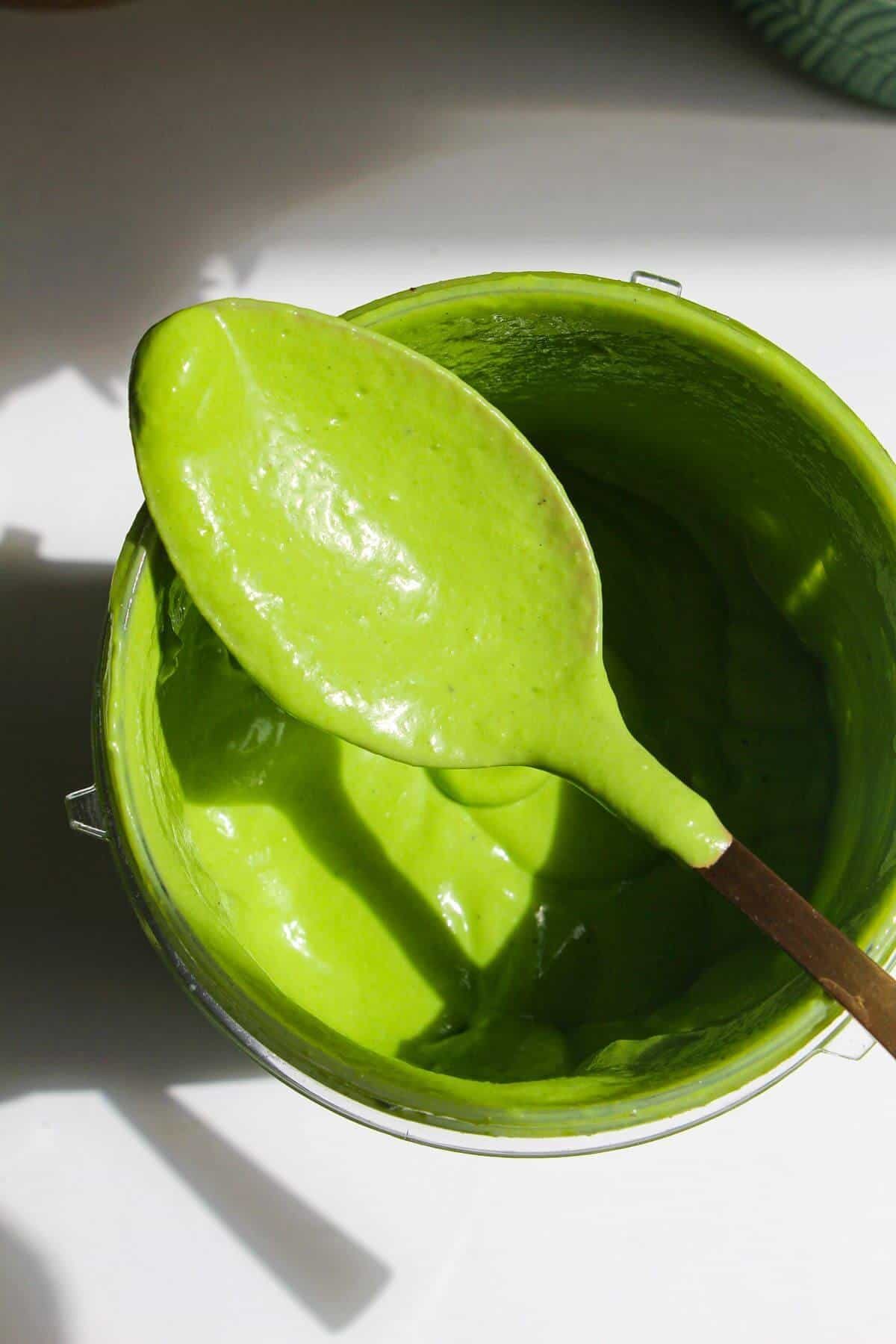 Green Caesar sauce in blender.