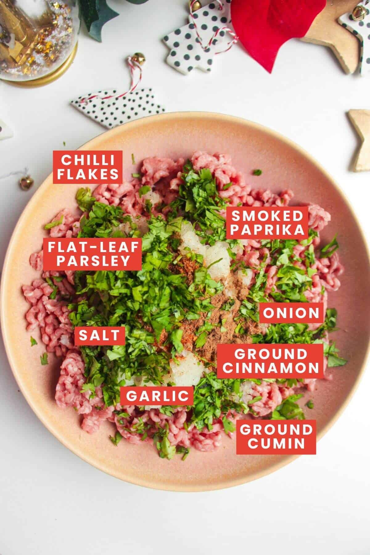 Meatball ingredients in a pink bowl and labelled.