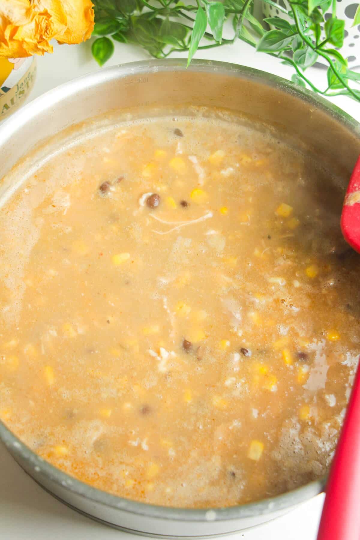 White chicken chili simmered in a pot.