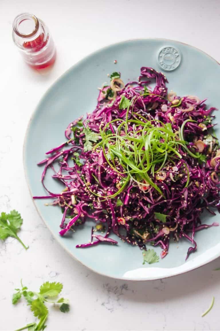 Crunchy Asian salad on a large light blue serving plate.