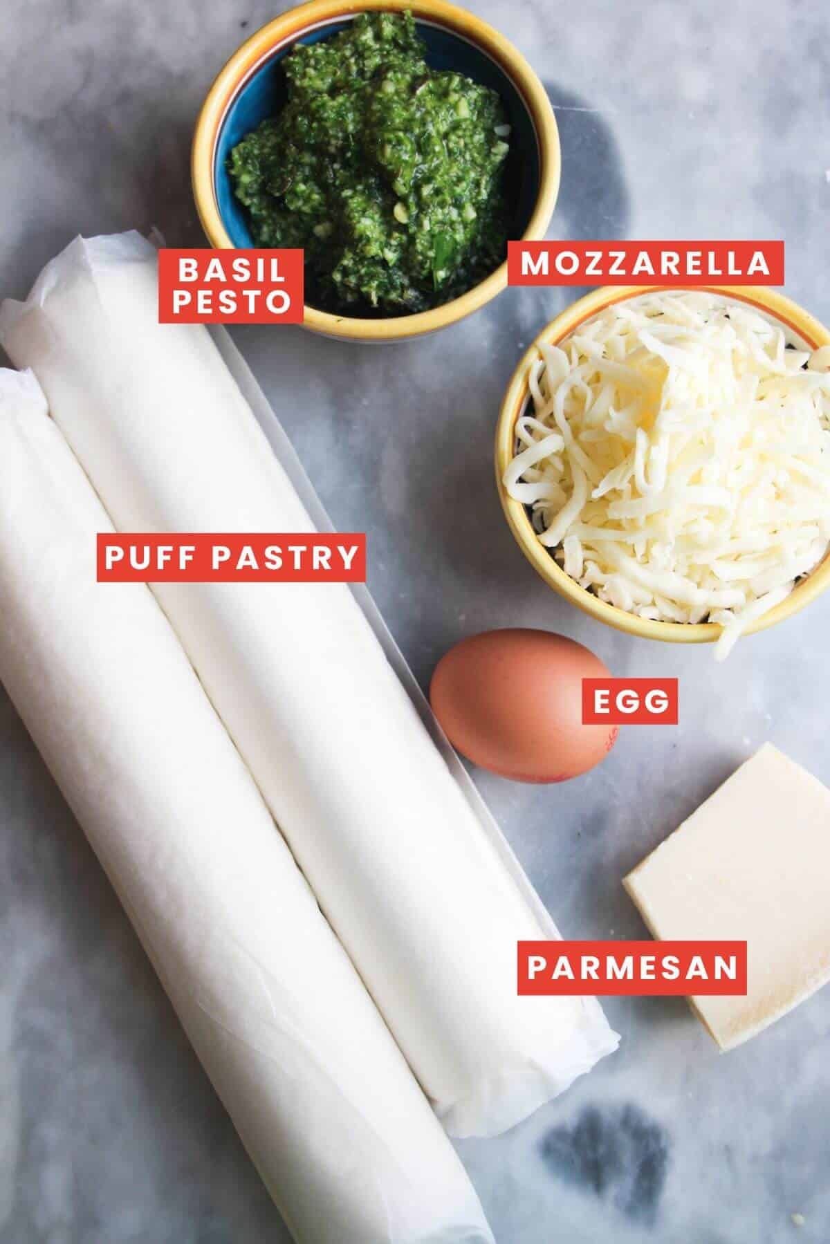 Ingredients for pesto puff pastry Christmas trees laid out and labelled.